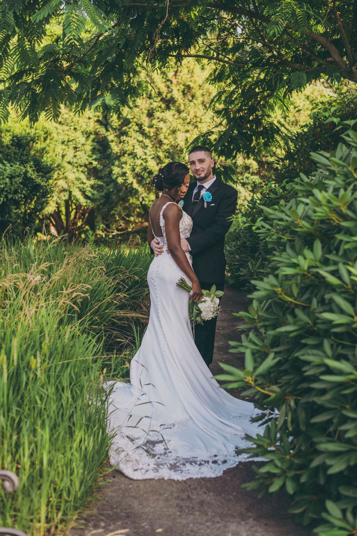 Garden wedding photography session with lush greenery and natural lighting.