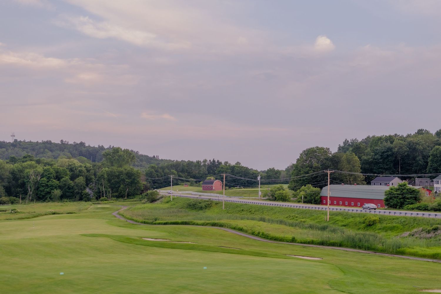 Rolling hills and scenic landscape of Oakmont Country Club's iconic golf course stretches across Pennsylvania countryside.