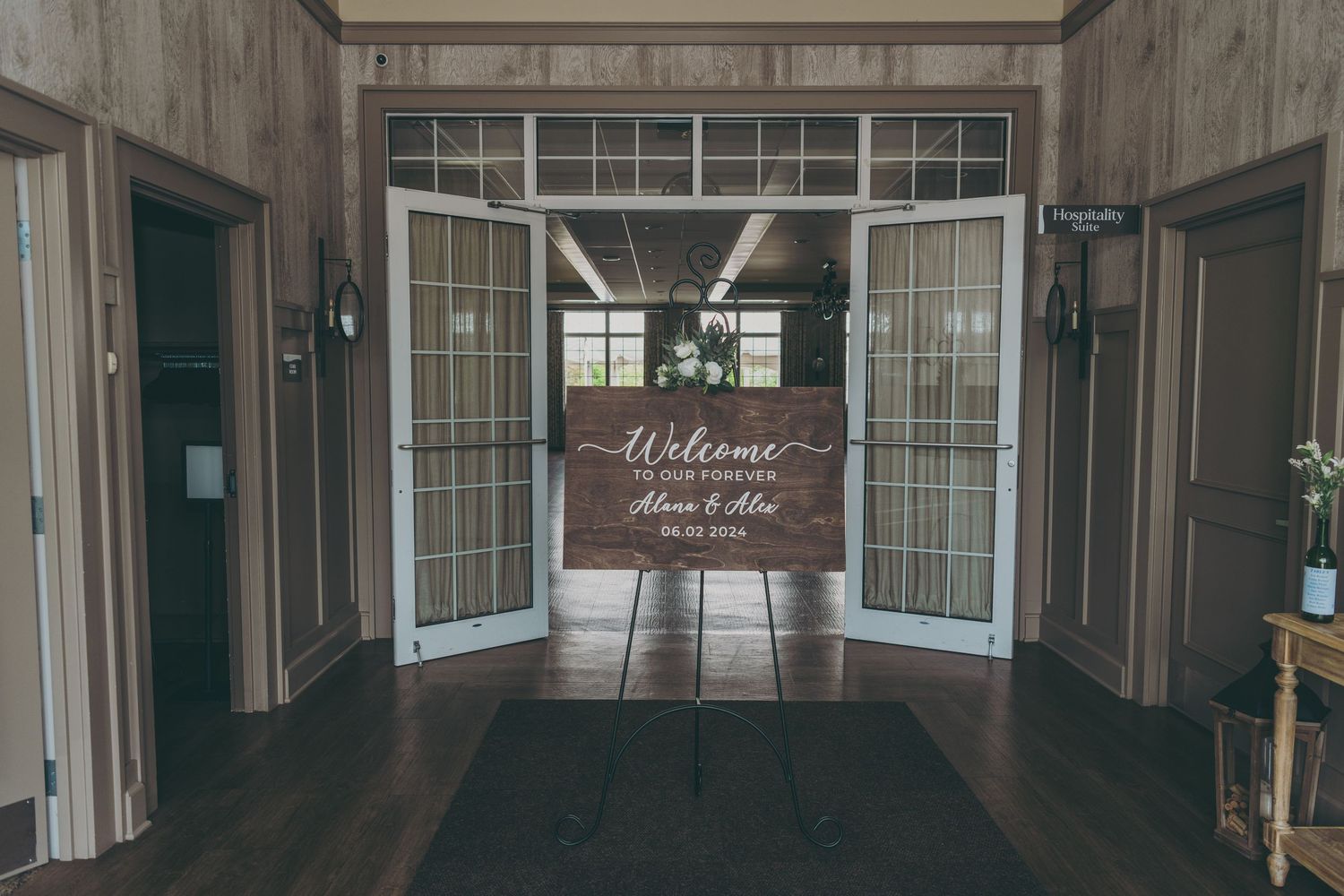 Modern barn interior with wooden beams and large windows creating an elegant event space.