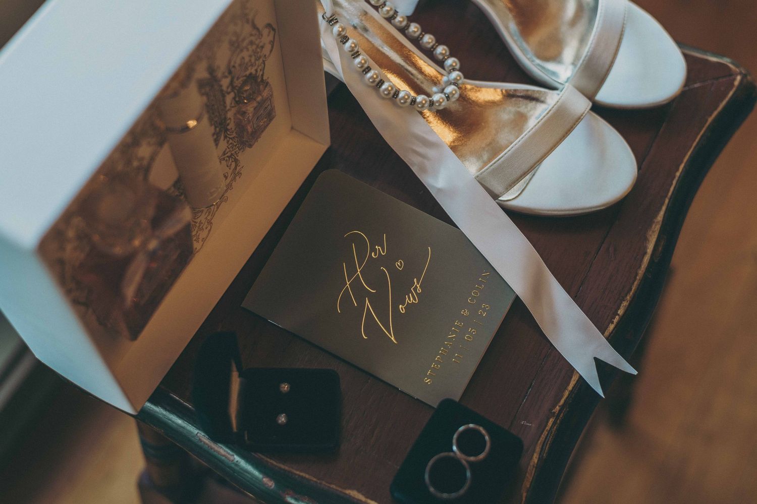Stylish black and brown glass perfume bottles arranged elegantly on a reflective surface.