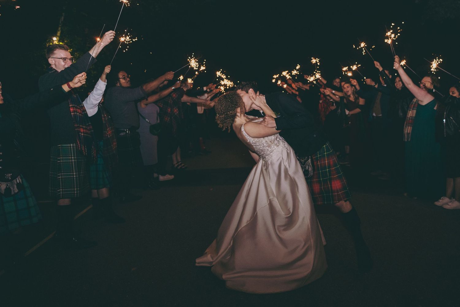 Romantic evening wedding celebration with string lights and dancing under the stars.