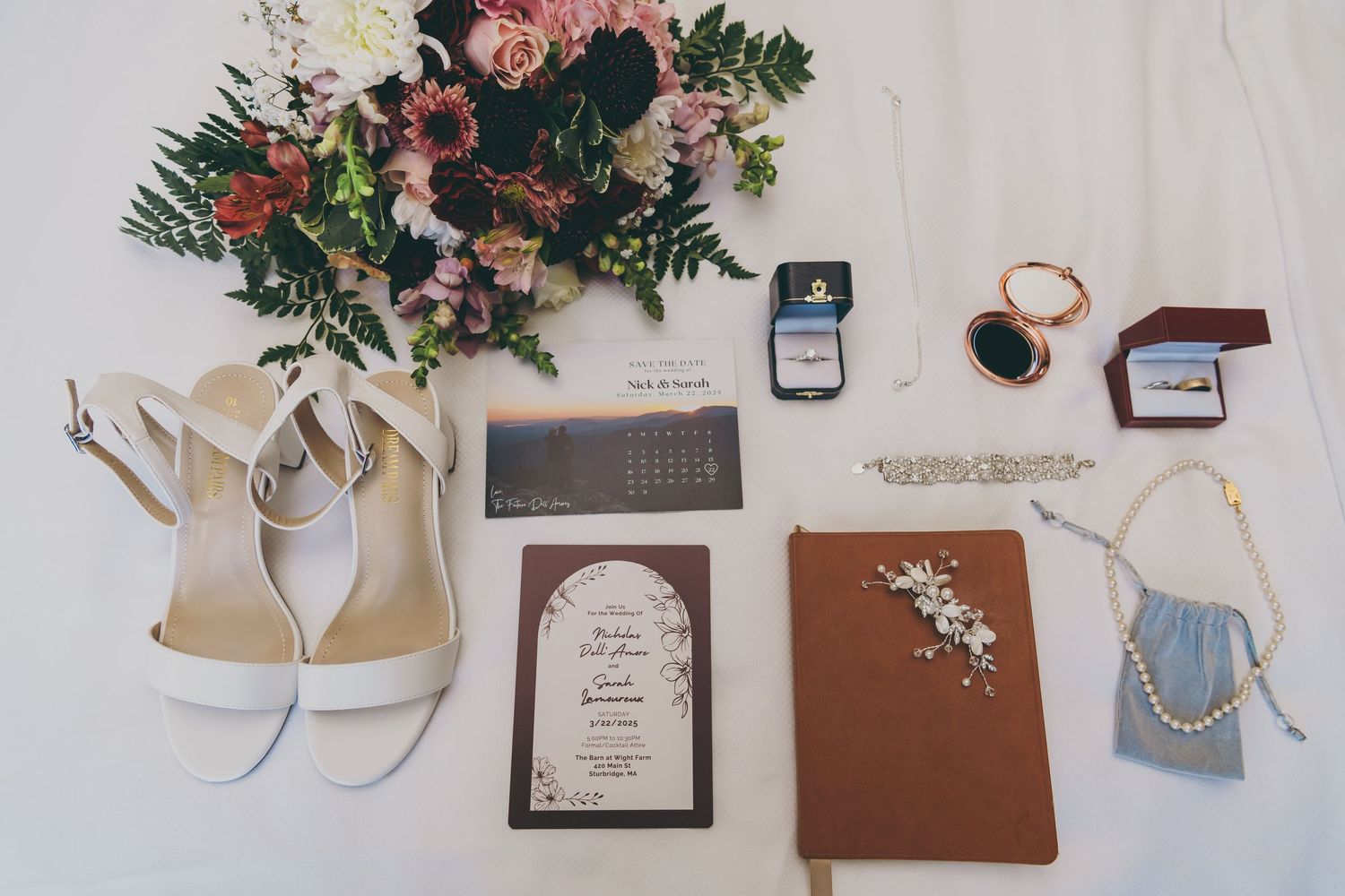 Wedding accessories including flowers, invitation, shoes, and small purse arranged on white background.