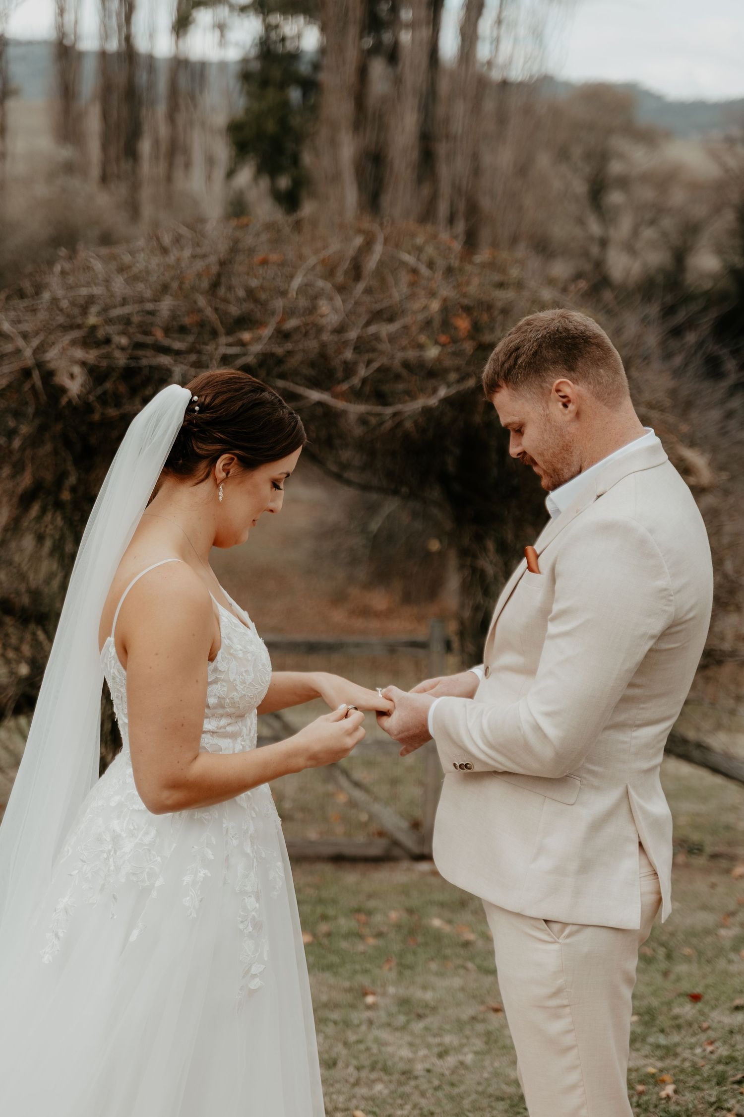 A bride and groom exchanging rings