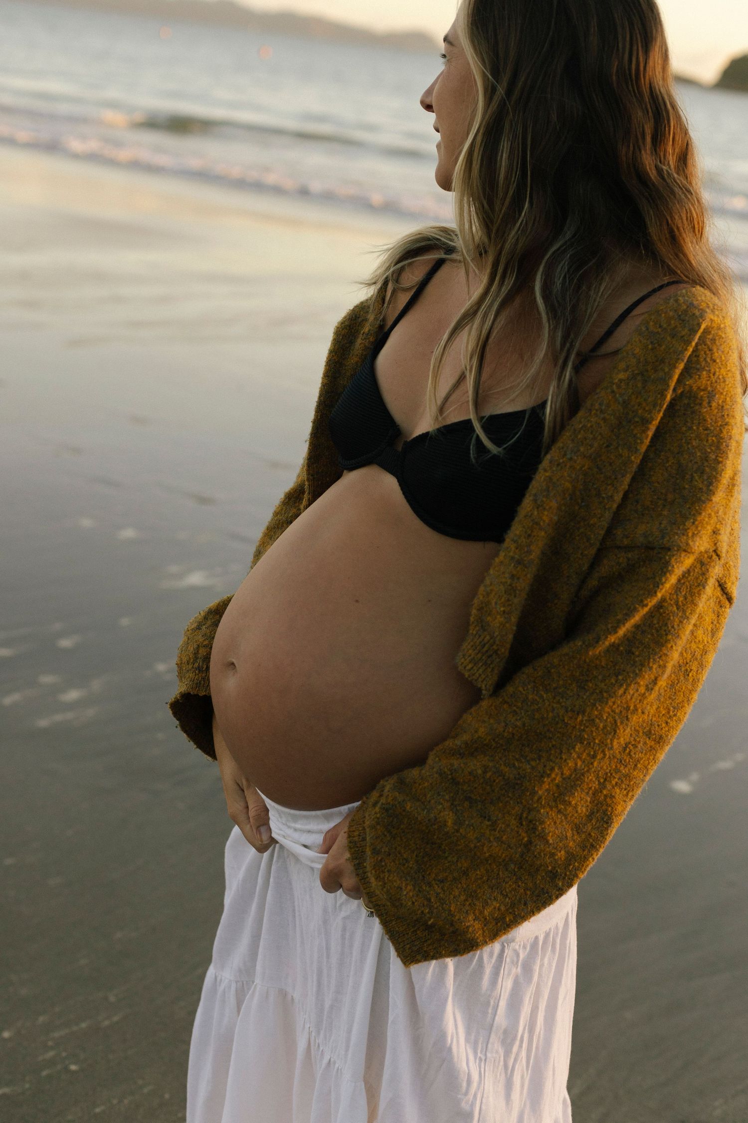 Empowering maternity photoshoot on beach