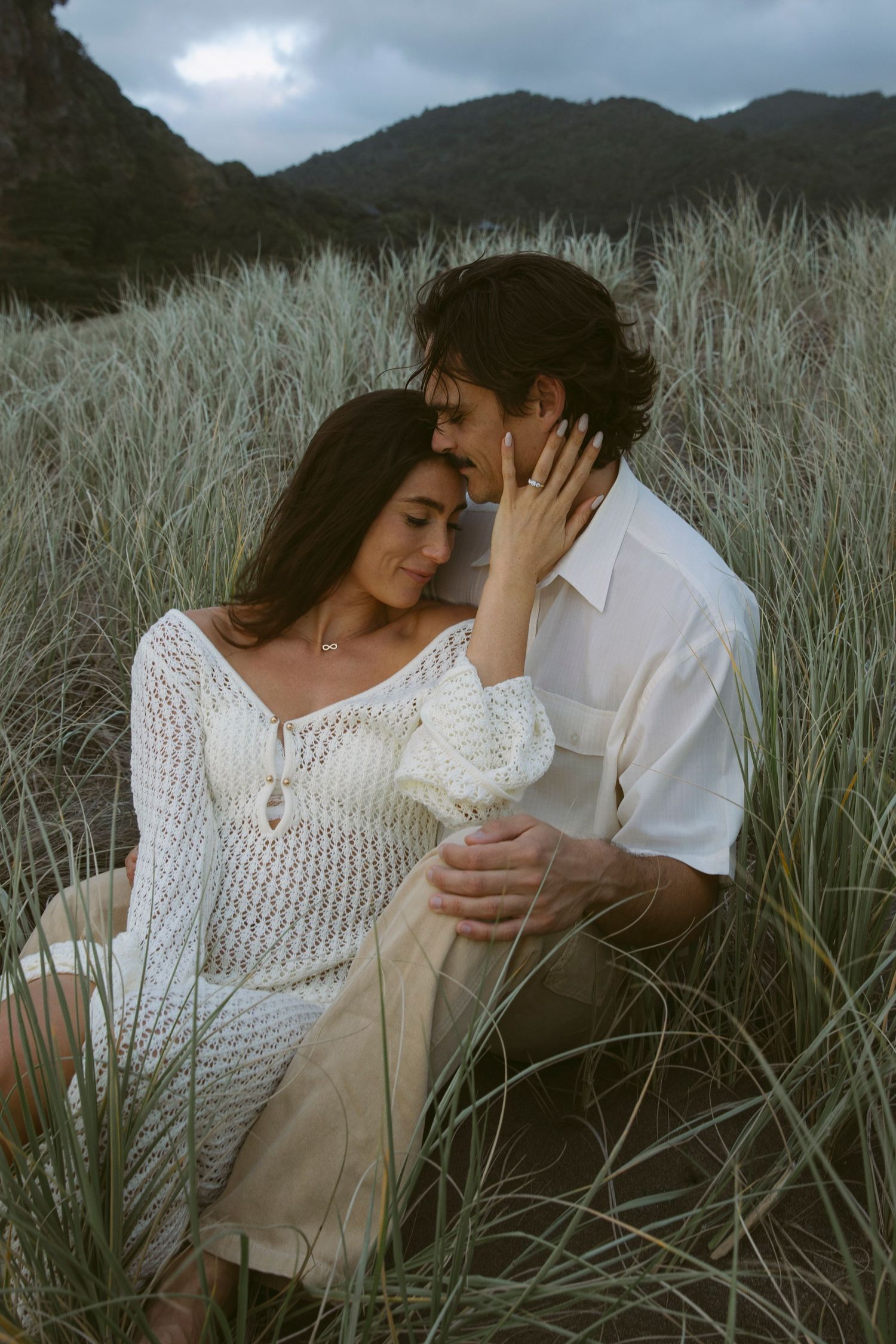 Couple embracing in the West Coast dunes