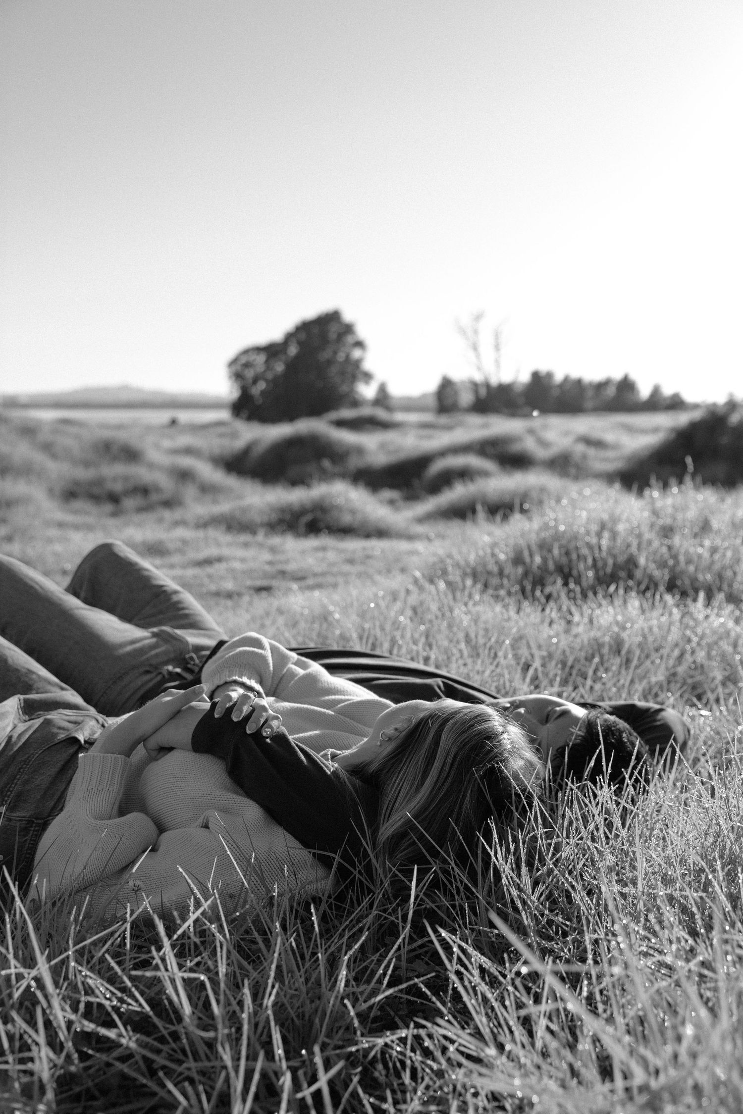 Couple laying in the grass