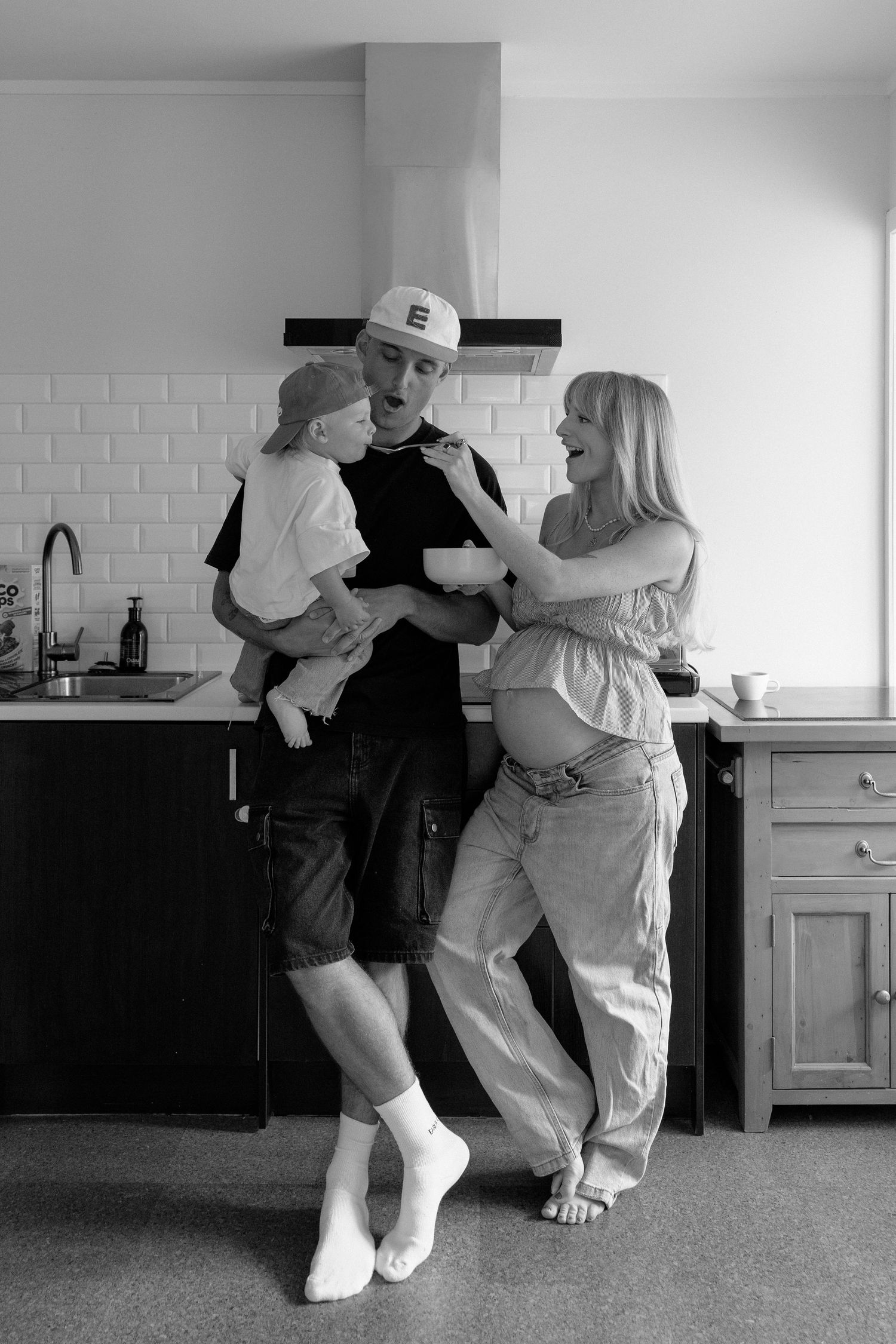 Growing family enjoying breakfast together during their family photoshoot