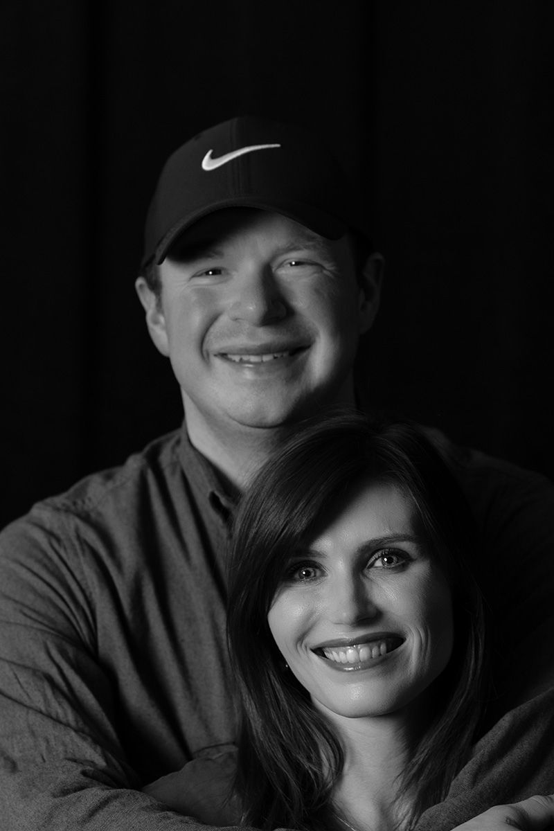 Low-key black and white portrait series showing intimate expressions.