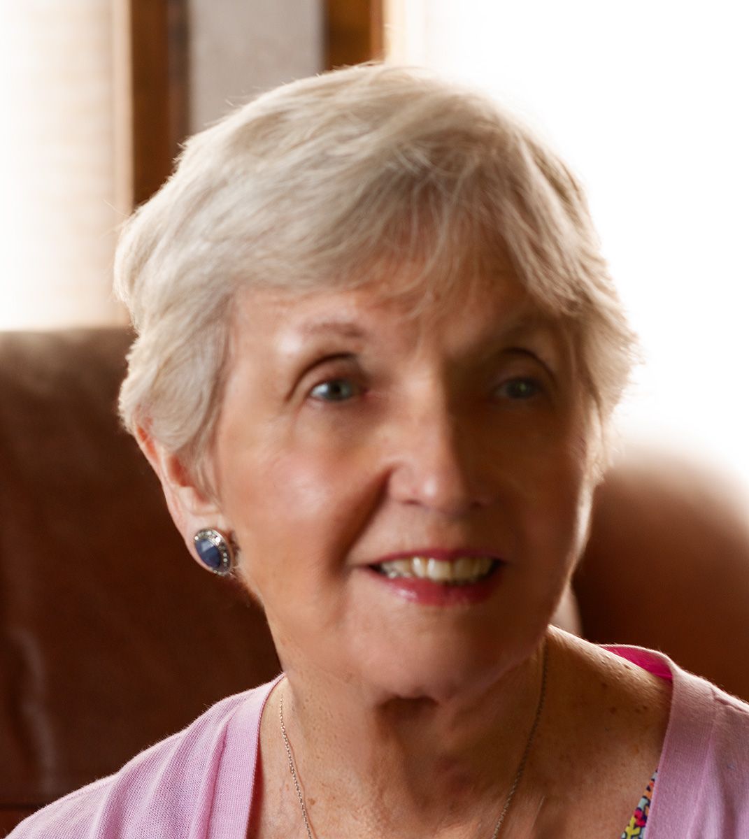 Portrait series showing different expressions against warm-toned background.