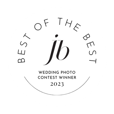 A circular black and white award badge for JB Wedding Photo Contest Winner 2023.
