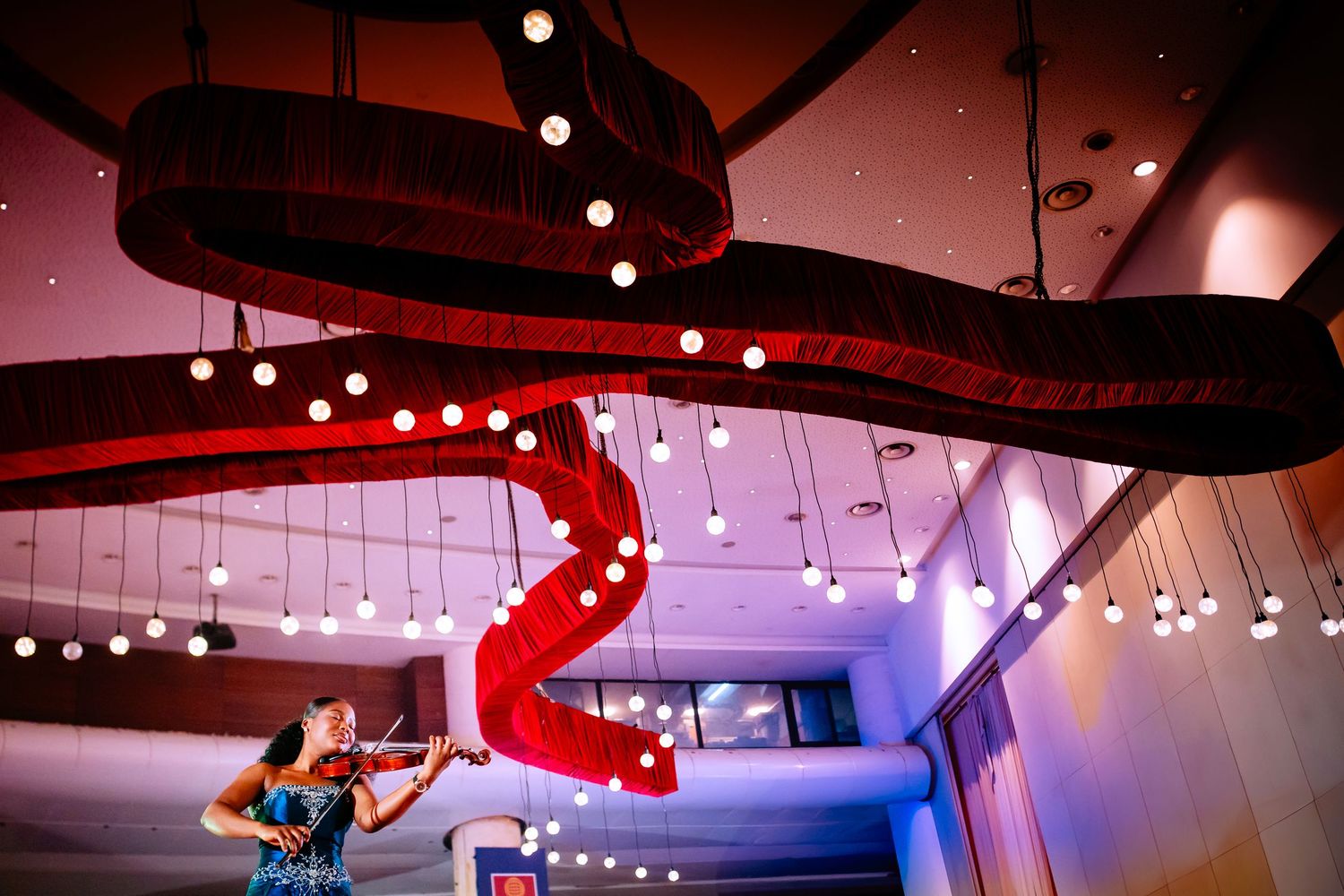Event venue ceiling with decorative string lights creating a warm ambiance.