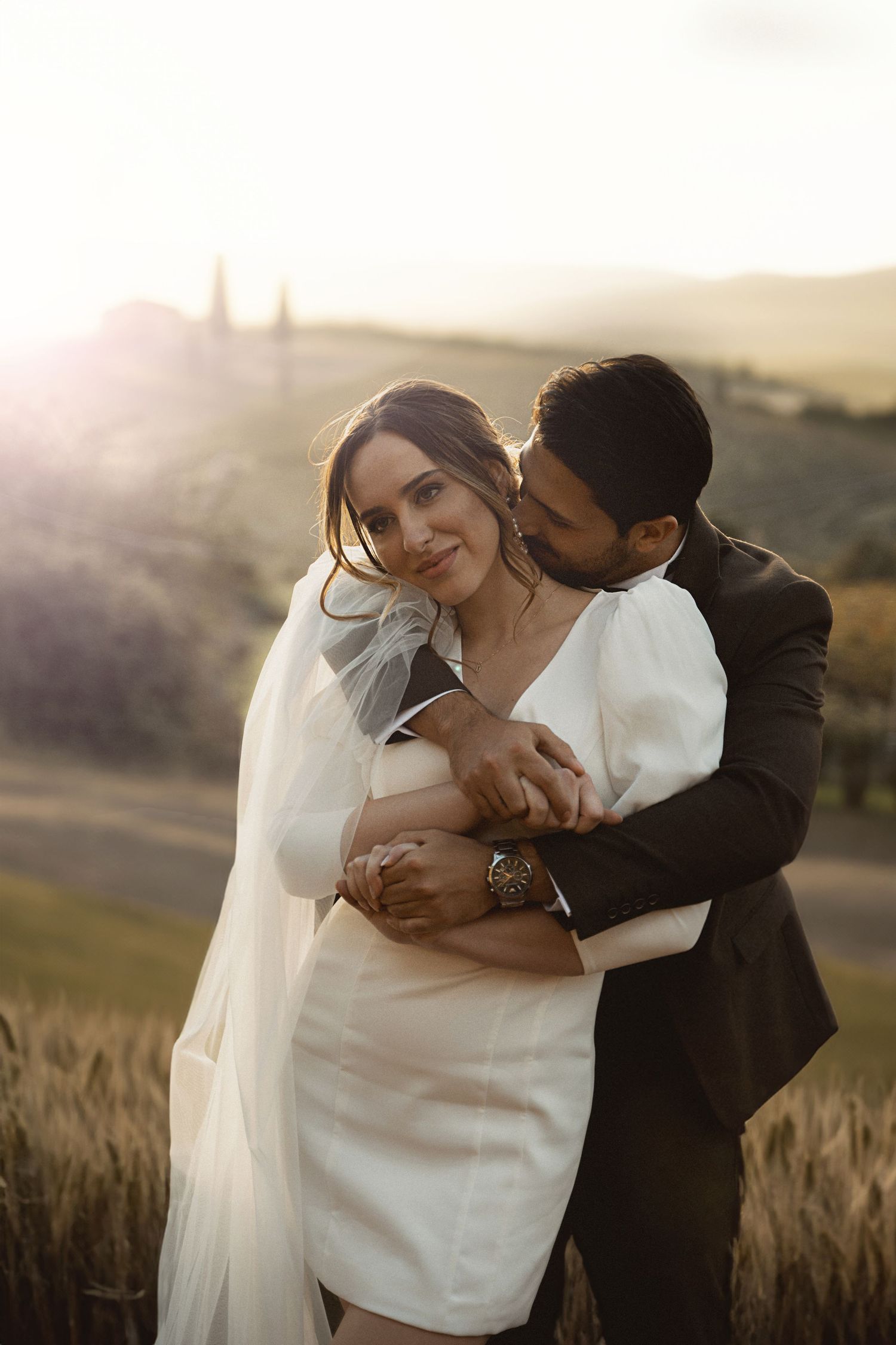 An intimate sunset moment captured in golden light against rolling hills.