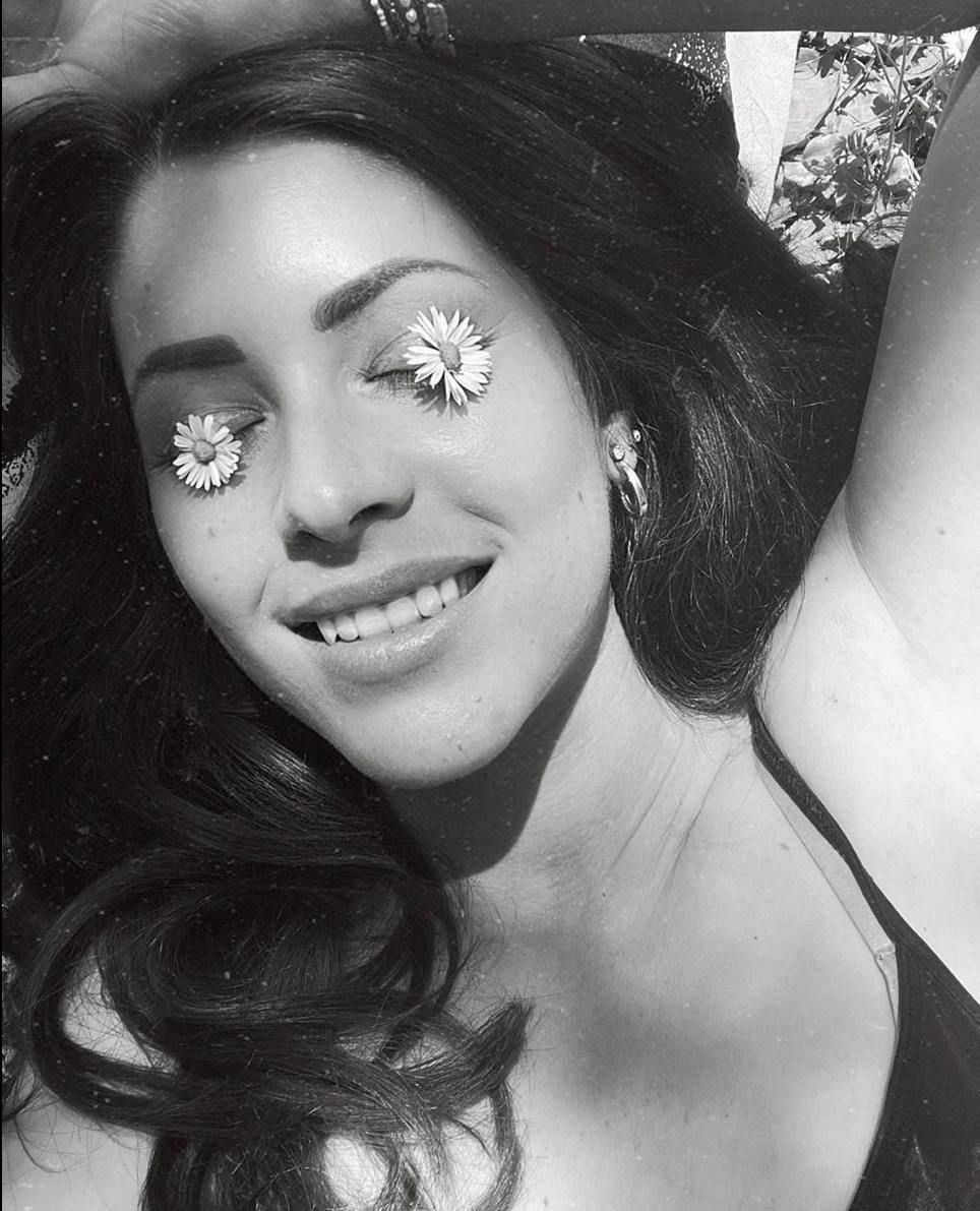Black and white artistic self-portraits with flowers.