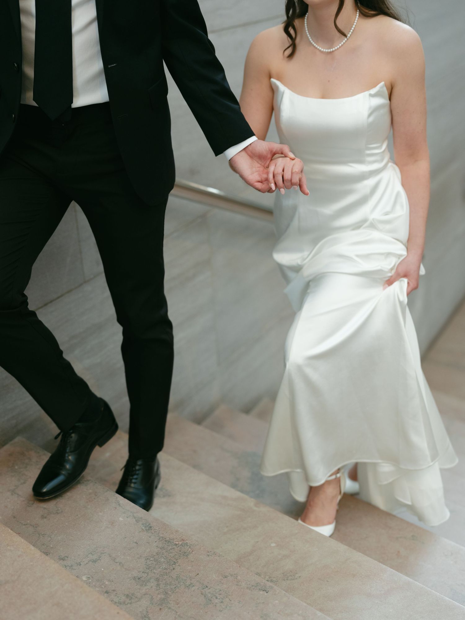 A couple dancing together showcasing the elegant movement of a white wedding dress.