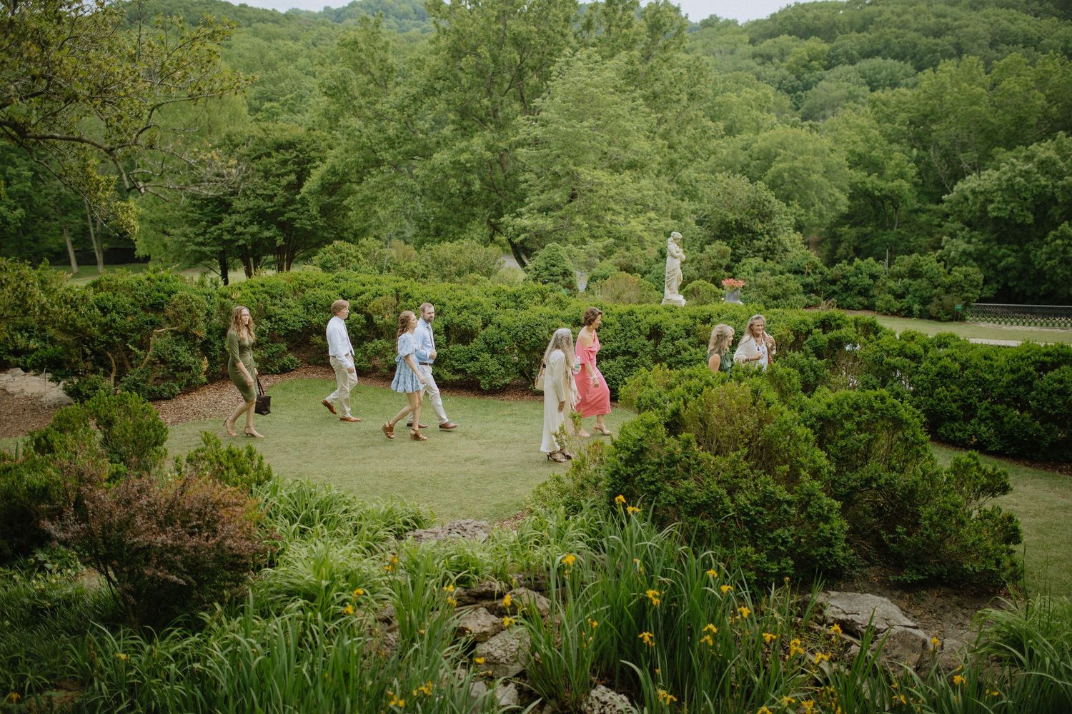 Scenic rolling hills and lush greenery create a natural backdrop for an outdoor wedding venue.