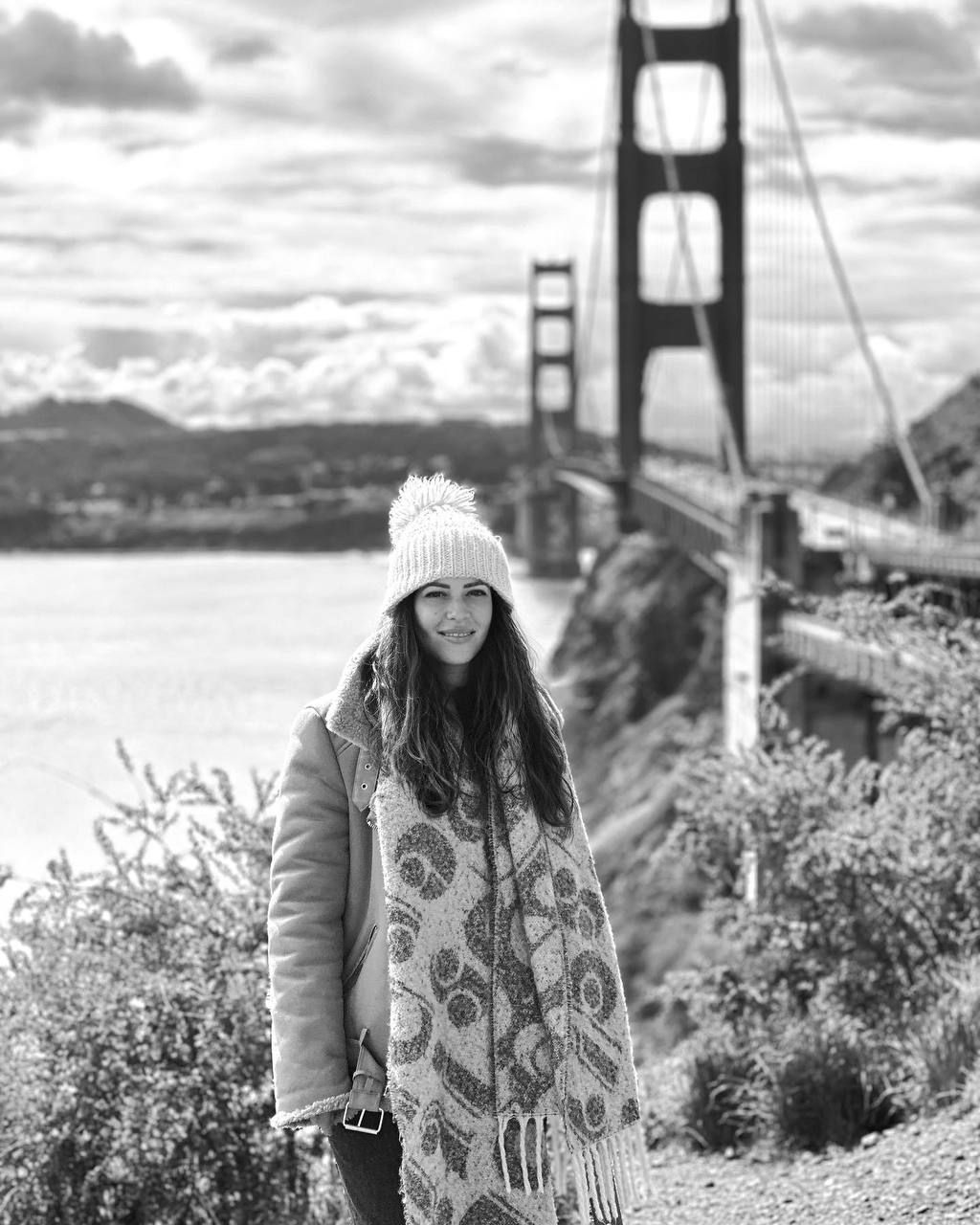 Scenic shots near Golden Gate Bridge with coastal vegetation.