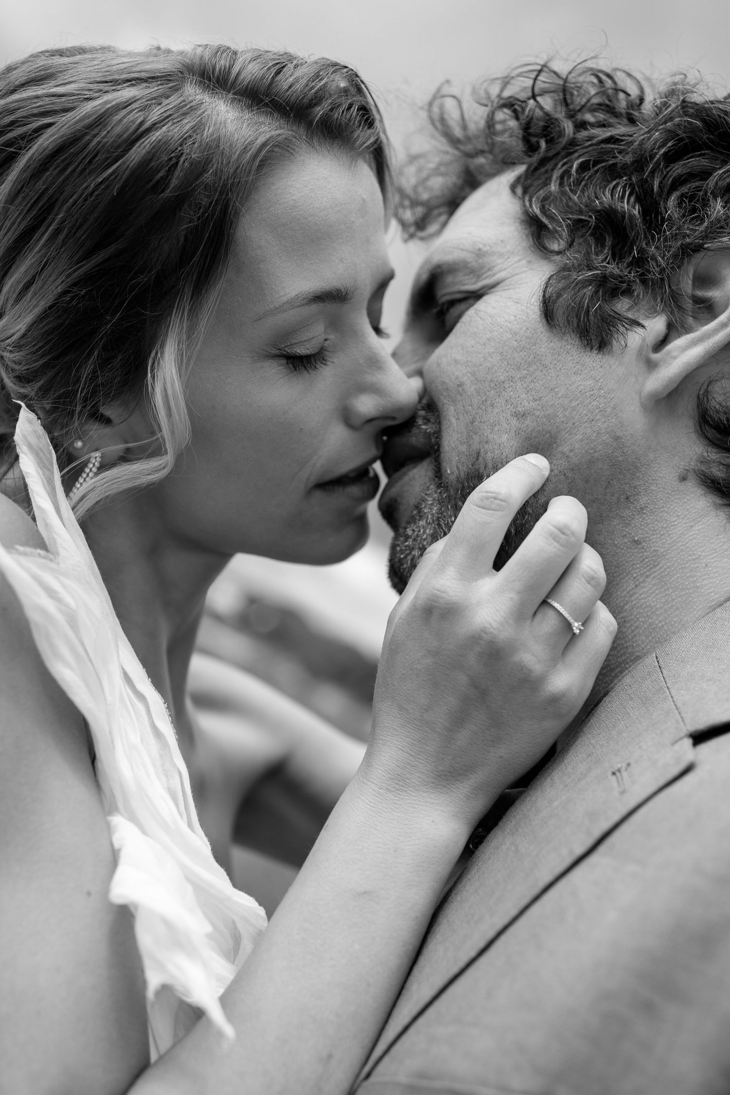 Black and white portrait capturing a tender moment between a couple.
