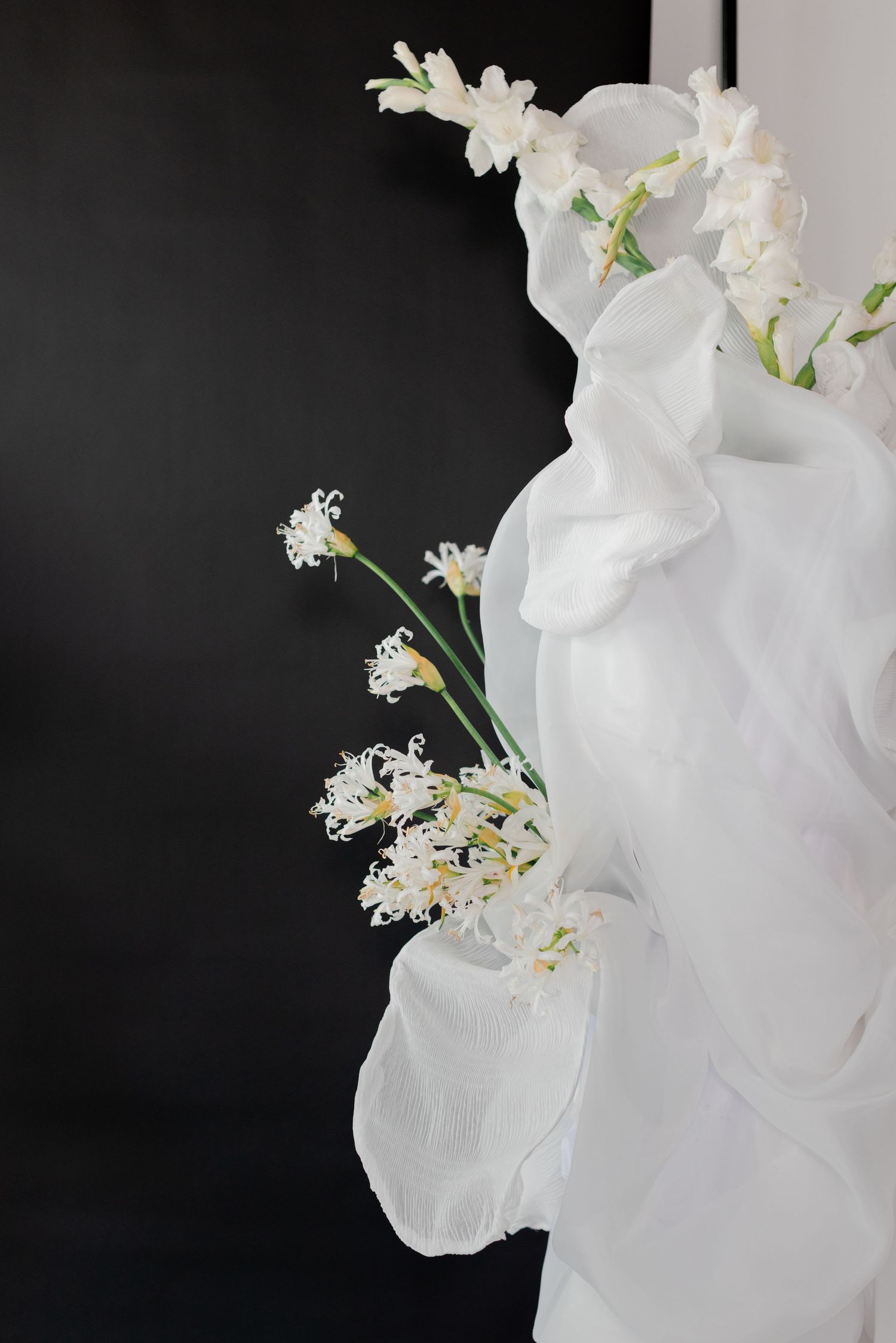 Elegant white orchids against dark background in wedding decor.