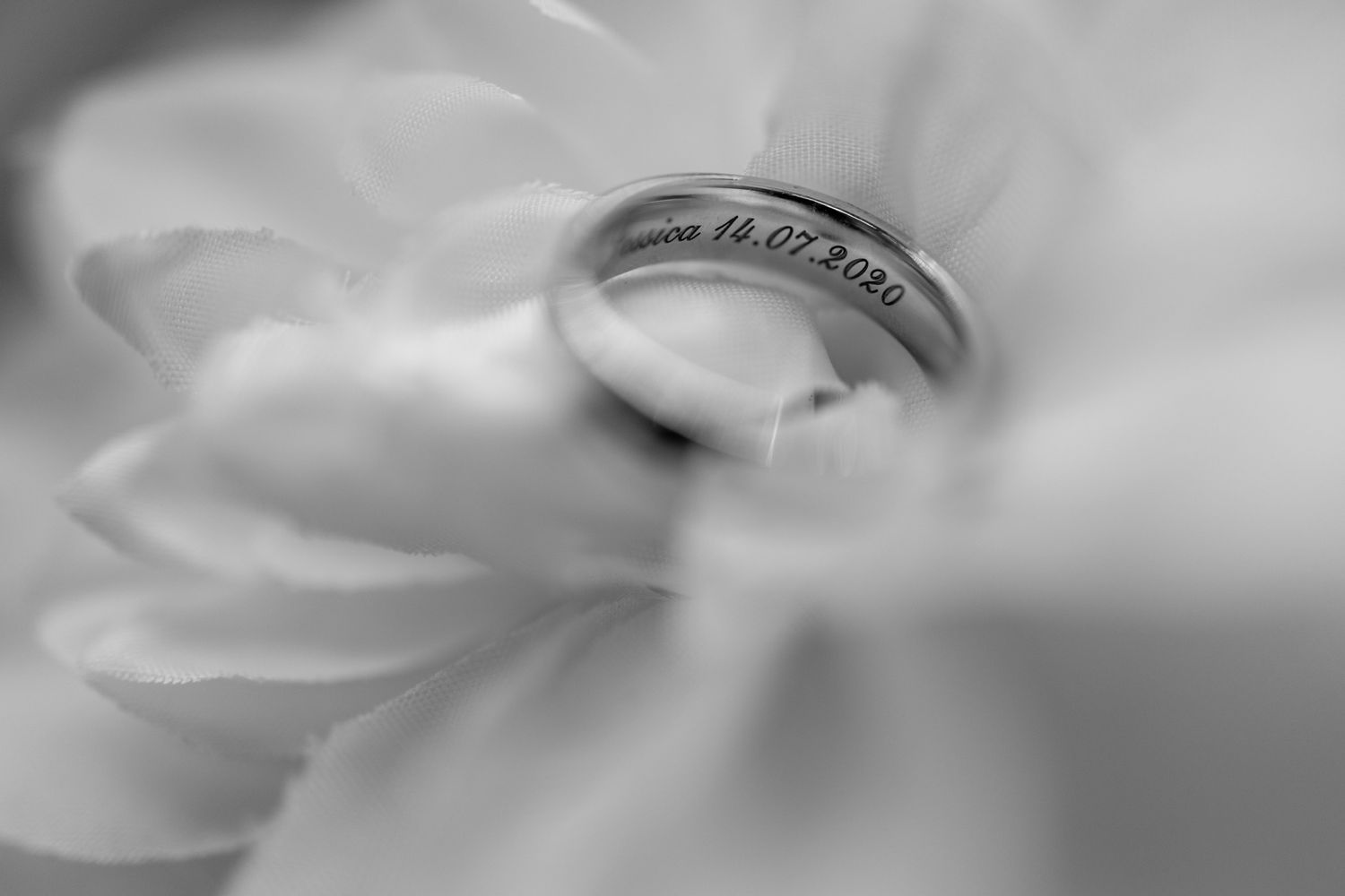 Abstract blurred black and white macro photography of flowing fabric texture.
