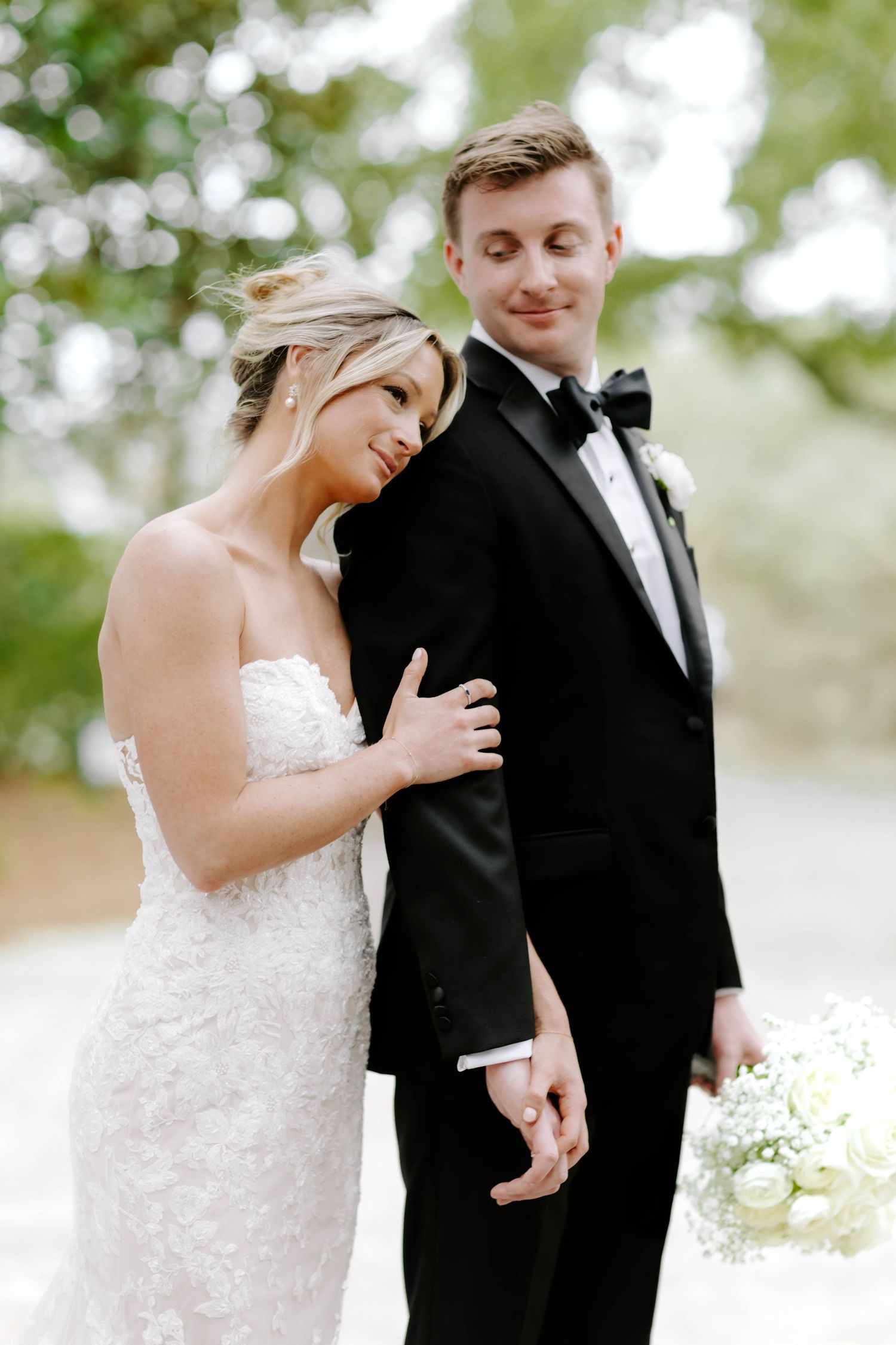 Romantic first look wedding moments captured in a series of candid outdoor portraits.