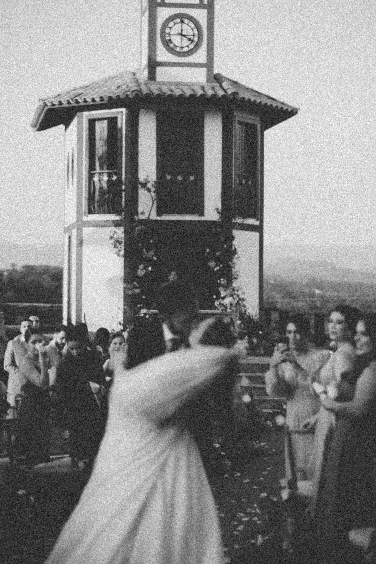 Vintage photograph of a gazebo with clock tower overlooking a scenic outdoor gathering space.