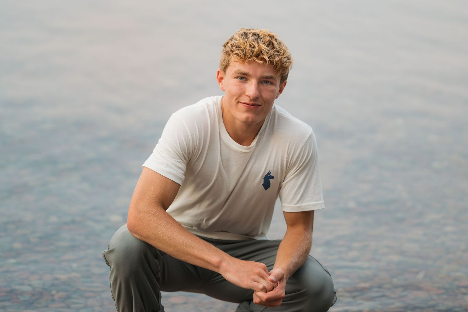 Natural light senior portrait with golden hour tones in Whitefish MT