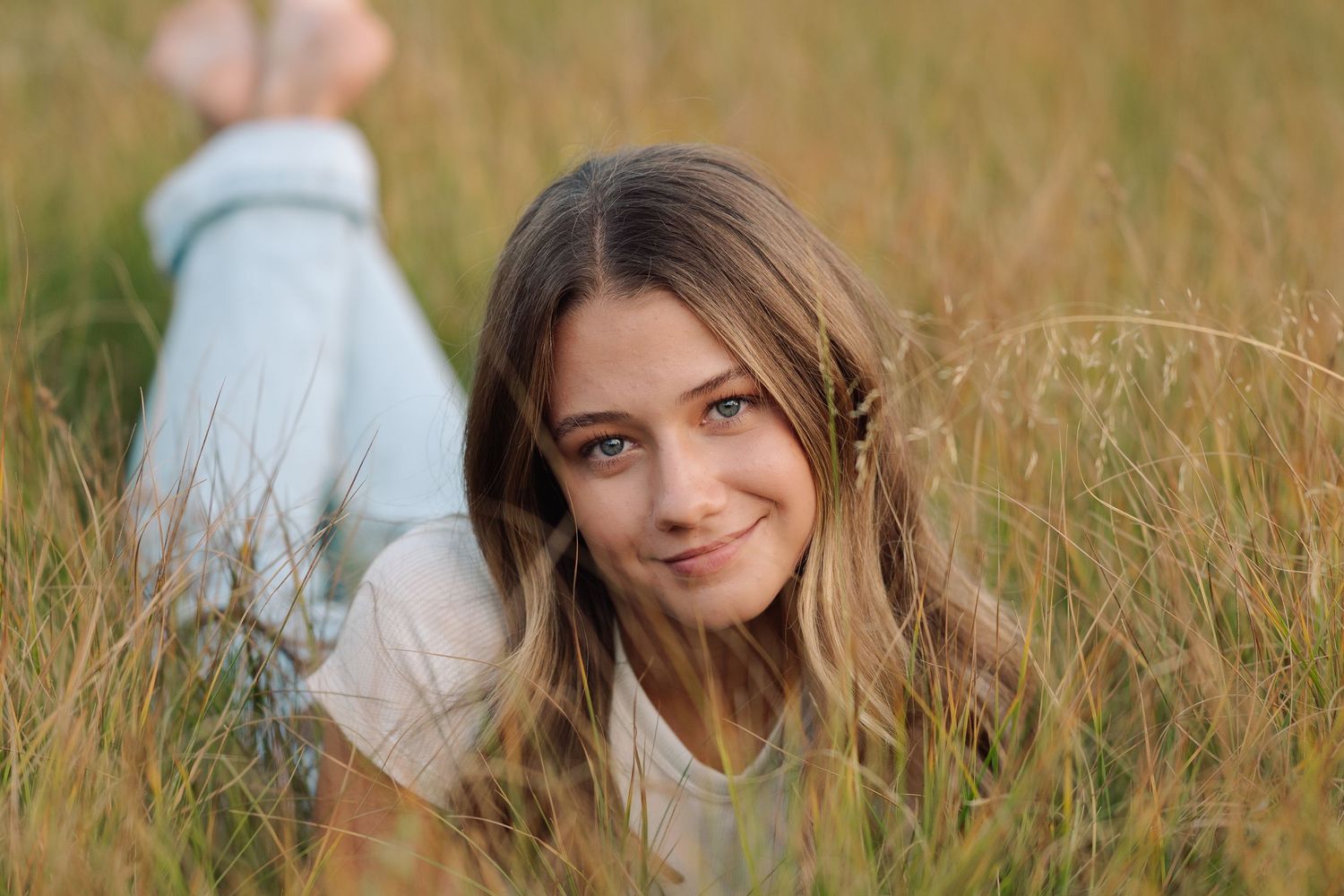 Senior photo with alpine backdrop outside Kalispell Montana