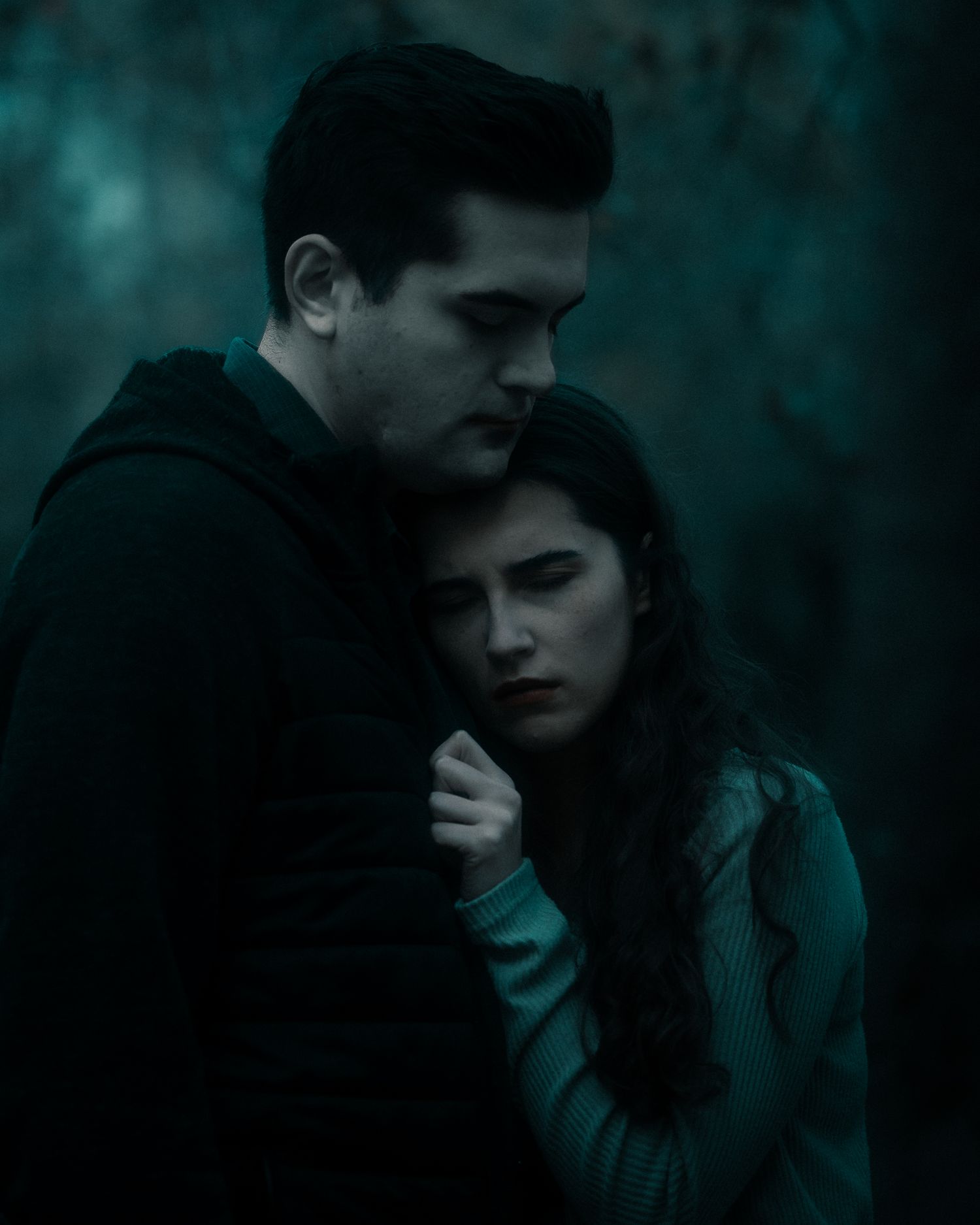 Dark moody collage of silhouettes and shadowy figures in teal and black tones creating a mysterious atmosphere.