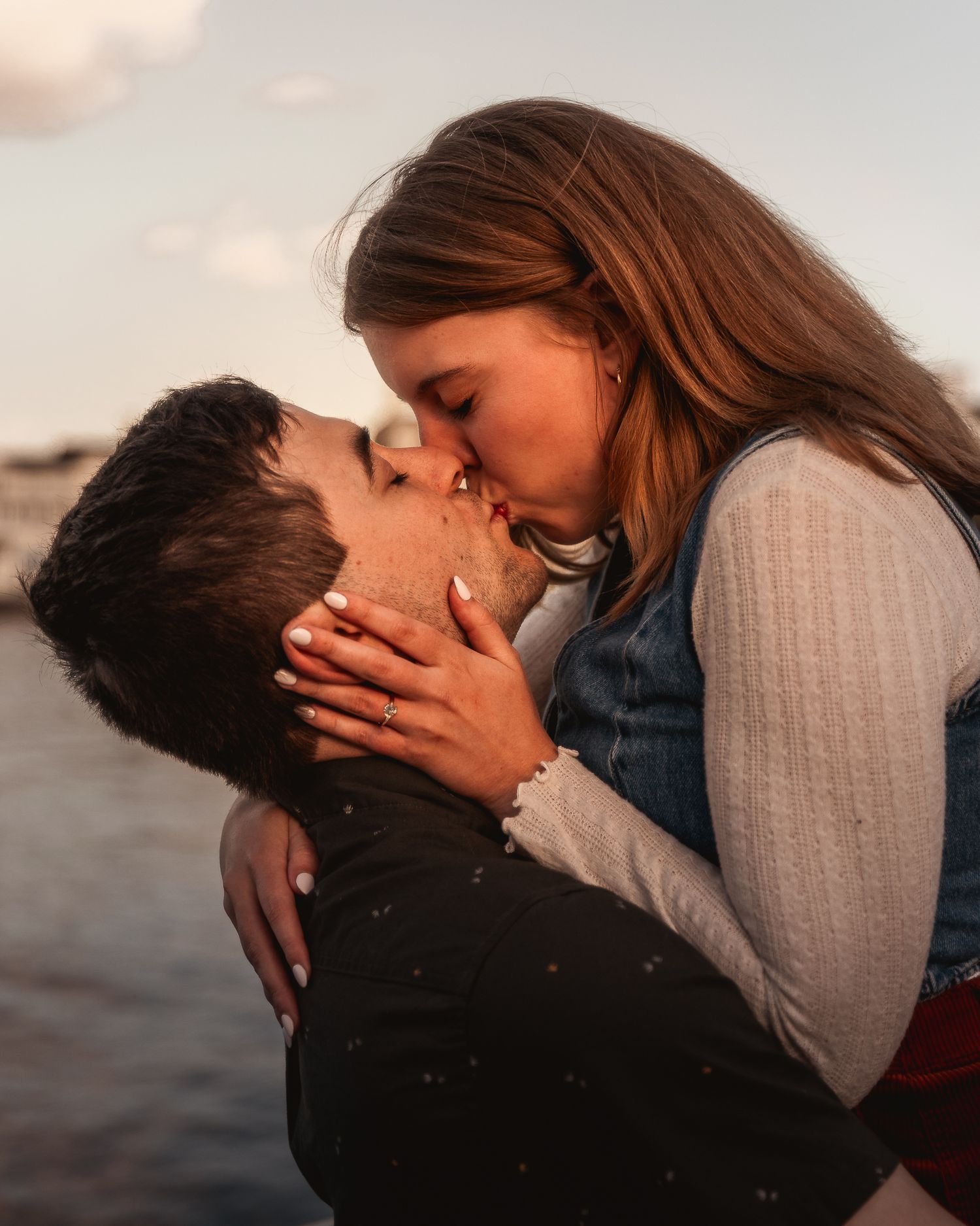 Romantic couple sharing intimate kisses in a sequence of five sunset silhouette photos.