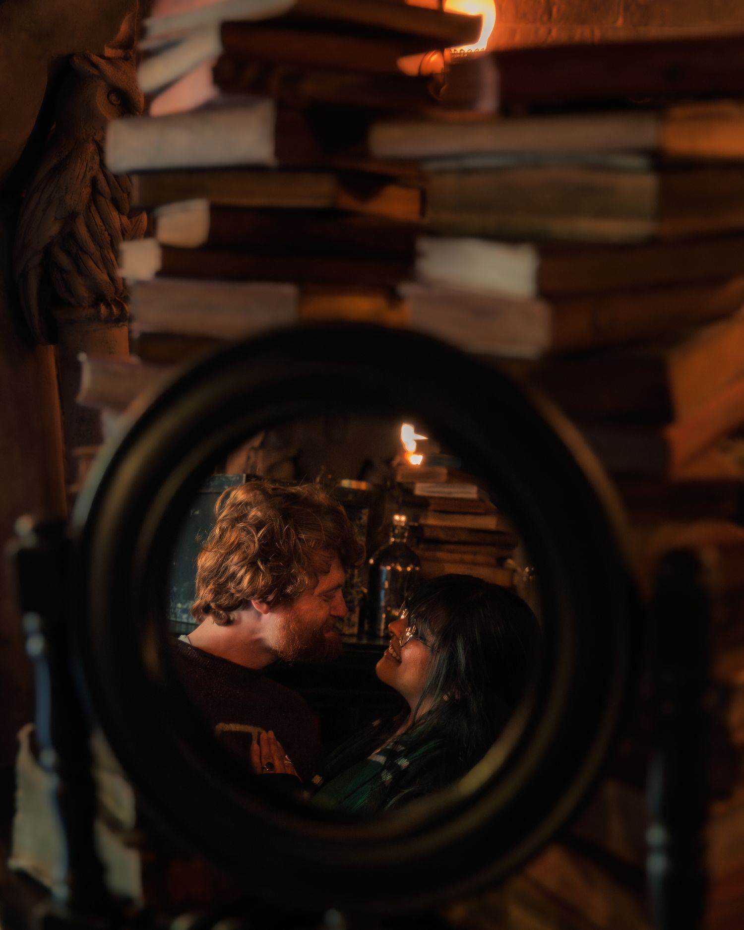Two people share an intimate moment in a dimly lit setting with warm lighting and shadows creating a moody atmosphere.