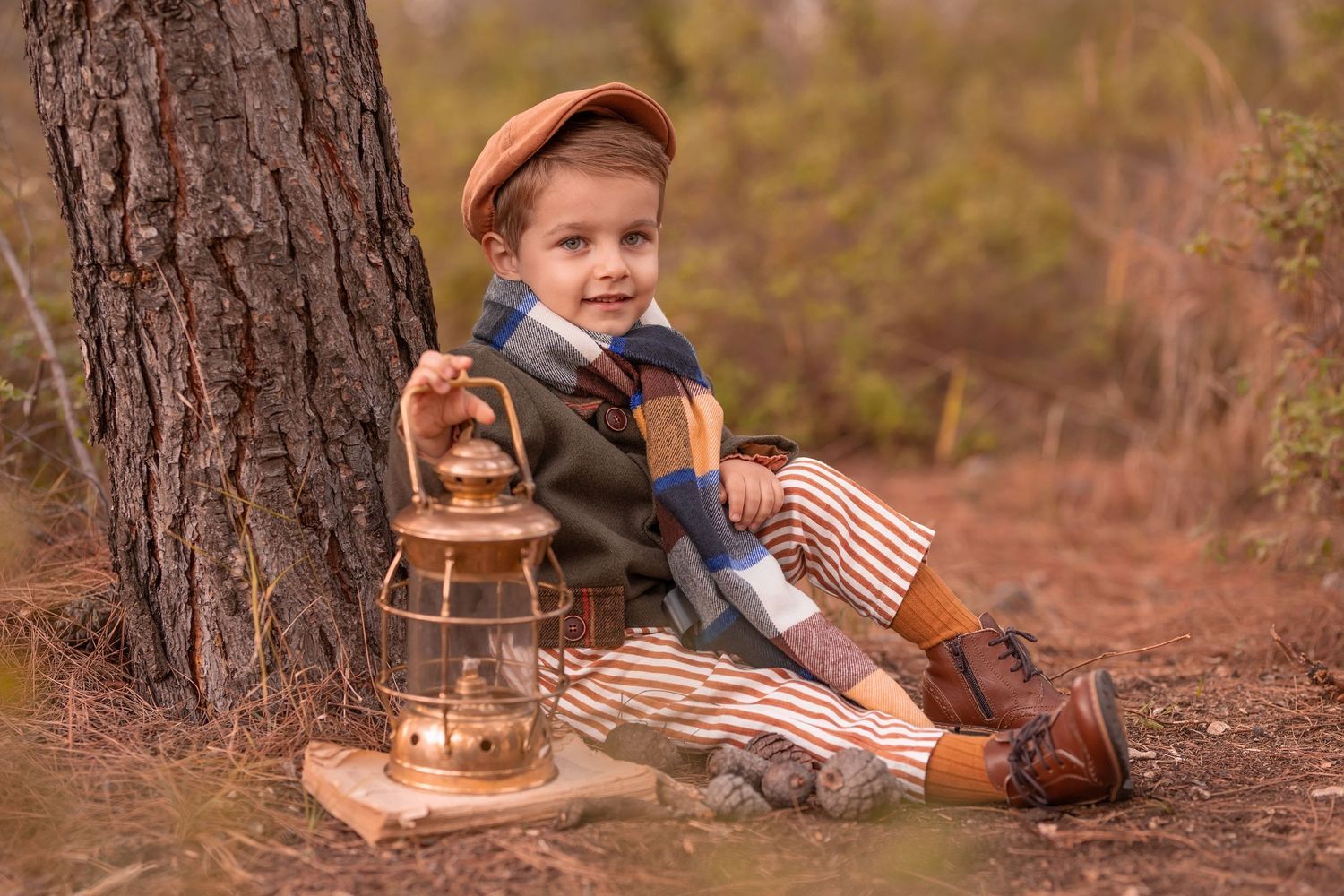 A vintage-themed scene with an antique lantern and rustic props against a tree in warm autumn lighting. Dubai Photographer
