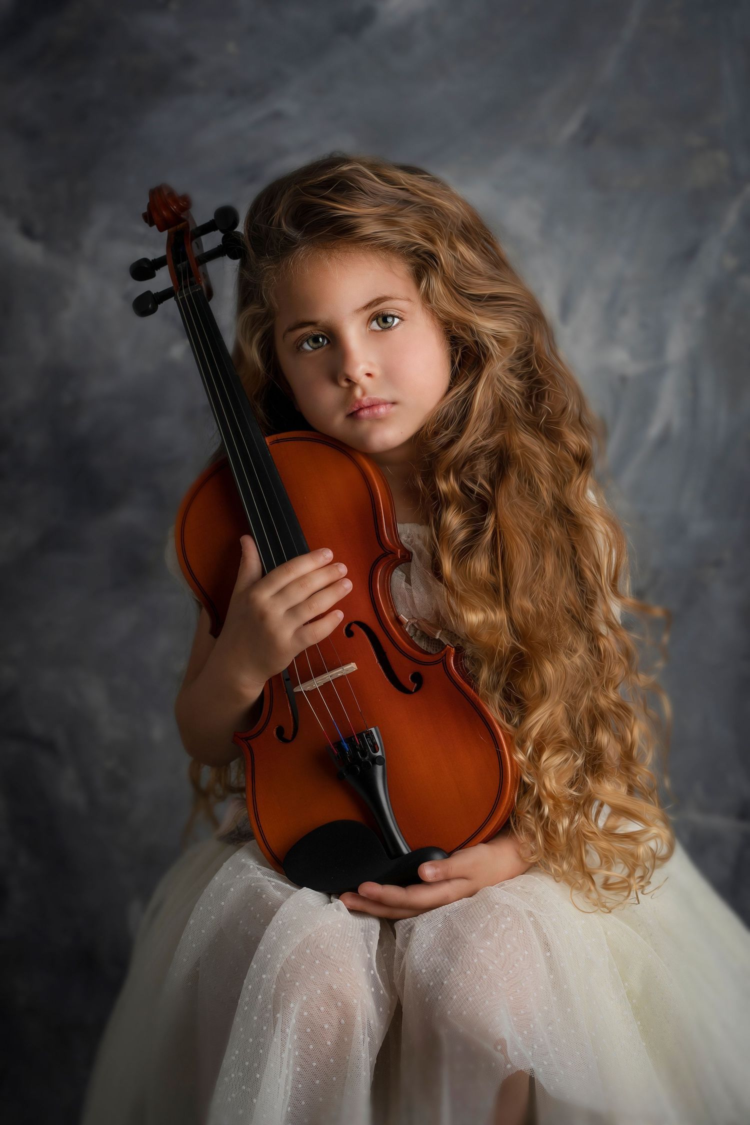 Fine art portrait with violin and flowing white dress against textured grey background. Dubai Photographer