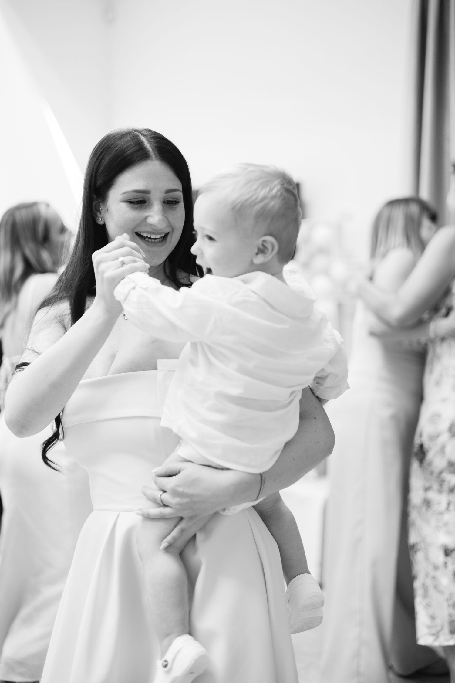 A series of candid dance moments captured in bright white tones at a celebration.