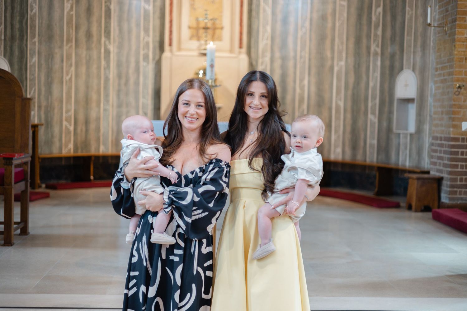 Group photo in a grand cathedral-style interior with wooden paneling.