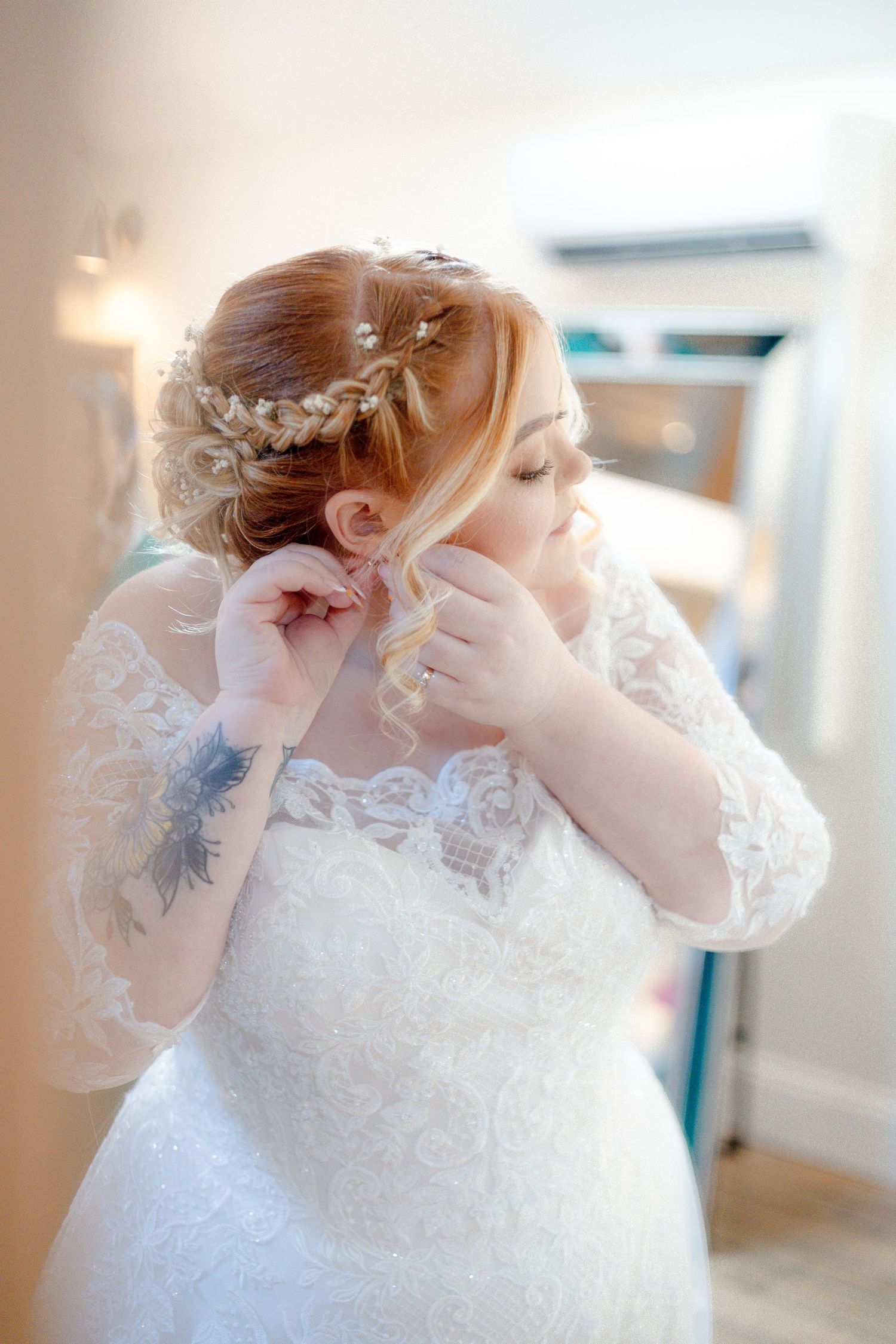 Close-up details of delicate lace on a white wedding dress.