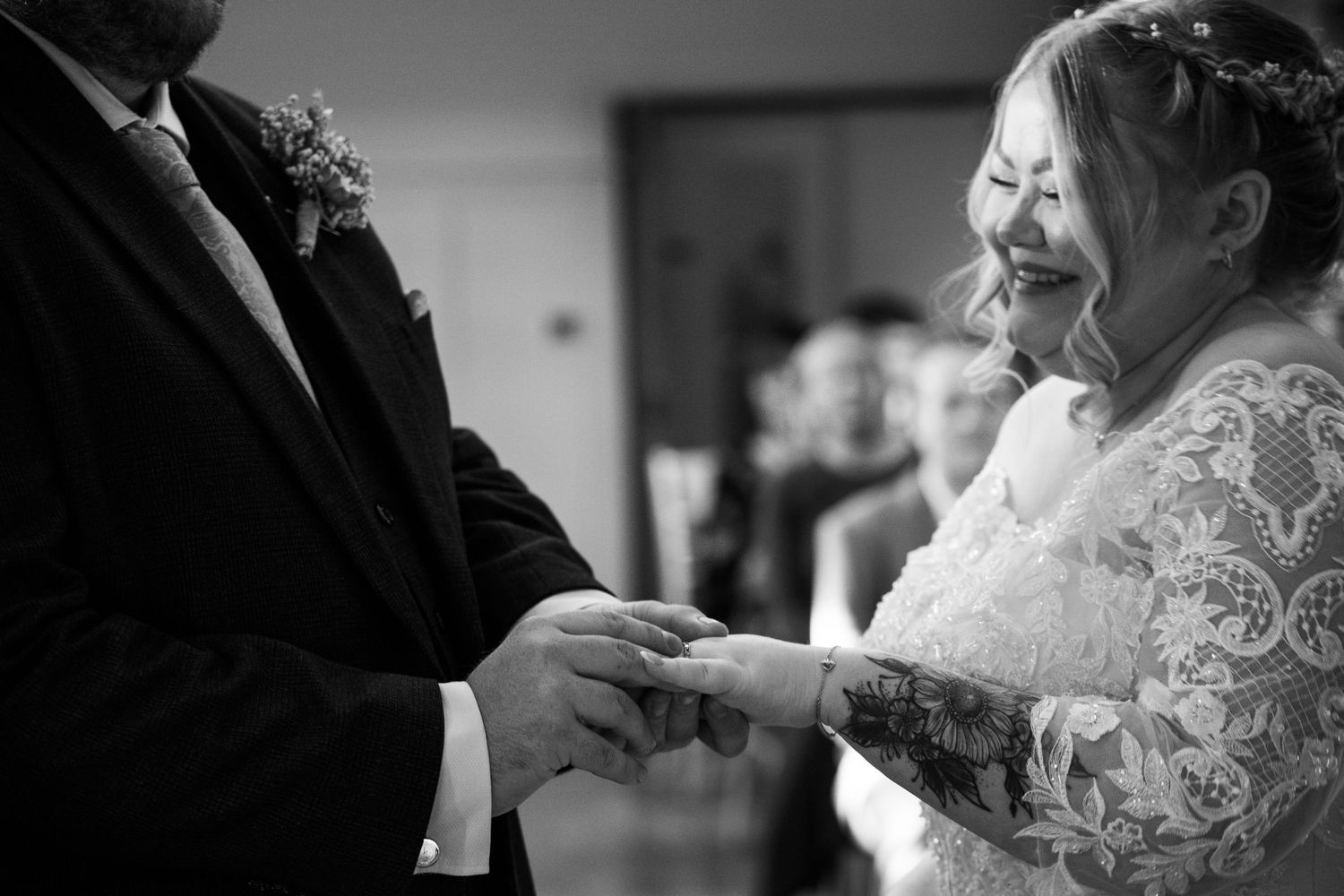 Black and white photos capturing emotional moments during a wedding ceremony.