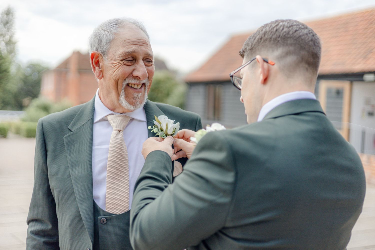 Candid moments shared between wedding party members in formal attire.