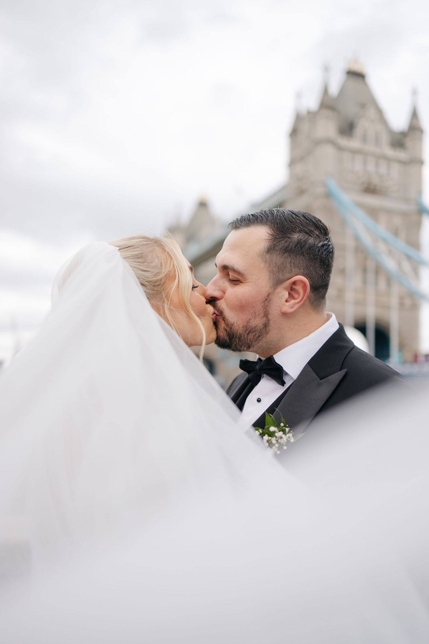 Romantic wedding portraits with Tower Bridge of London in the background.