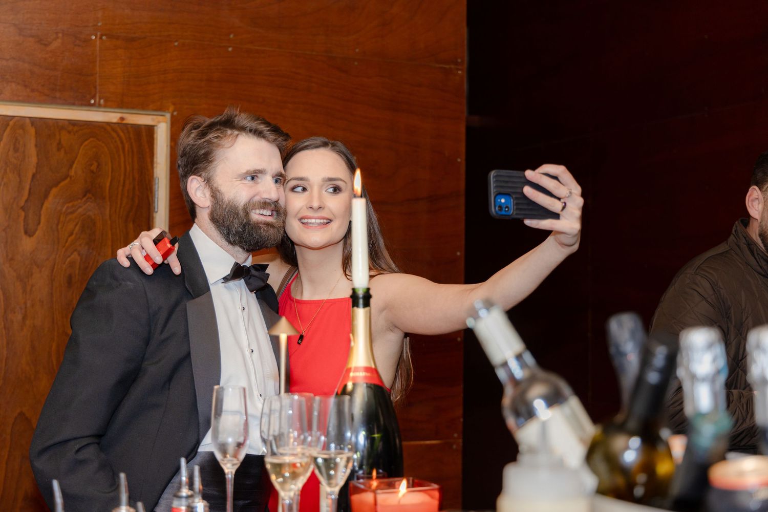 Guests enjoying drinks and conversation at formal evening event.