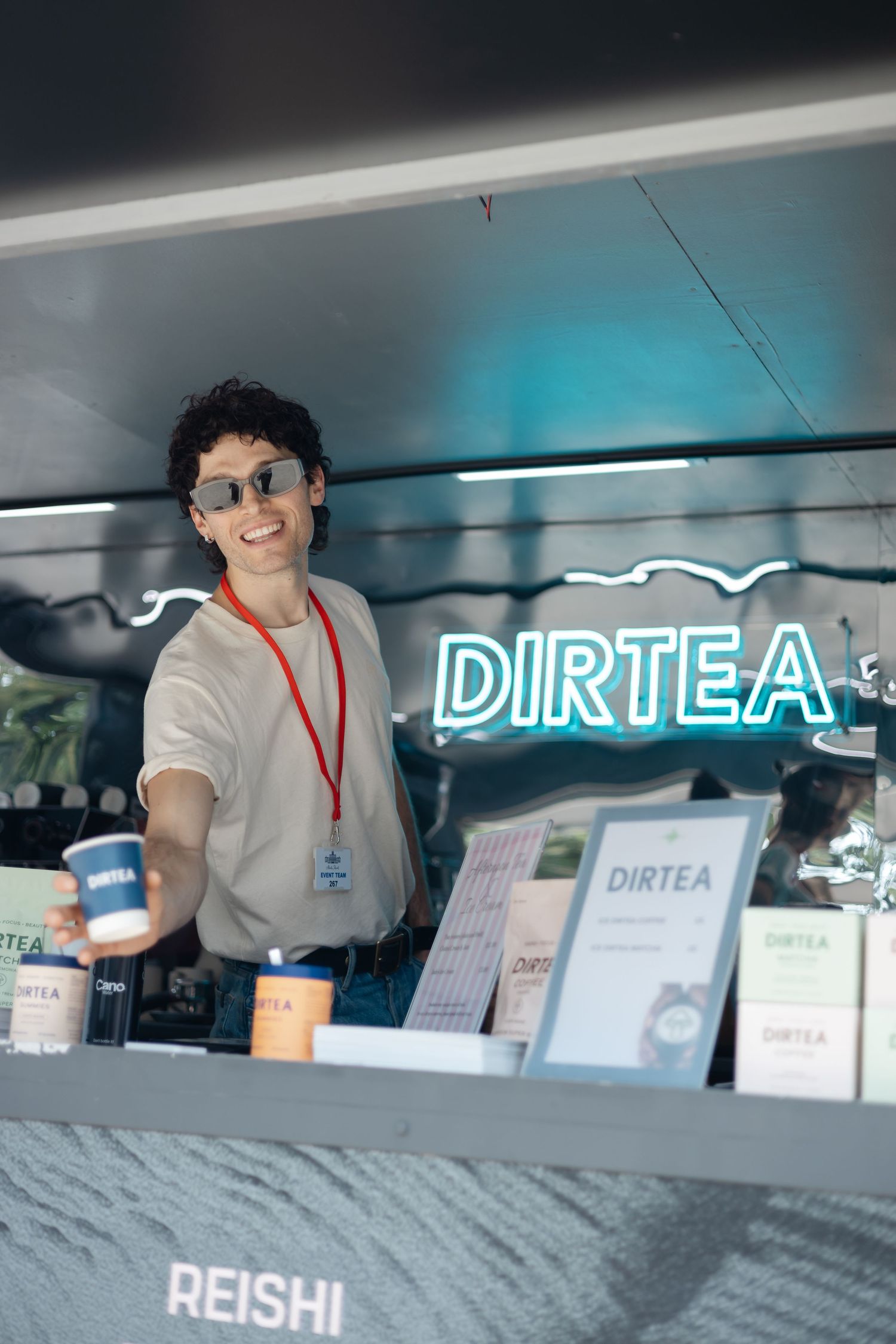 Modern food service counter with illuminated signage displaying 'DIRTEA' branding.
