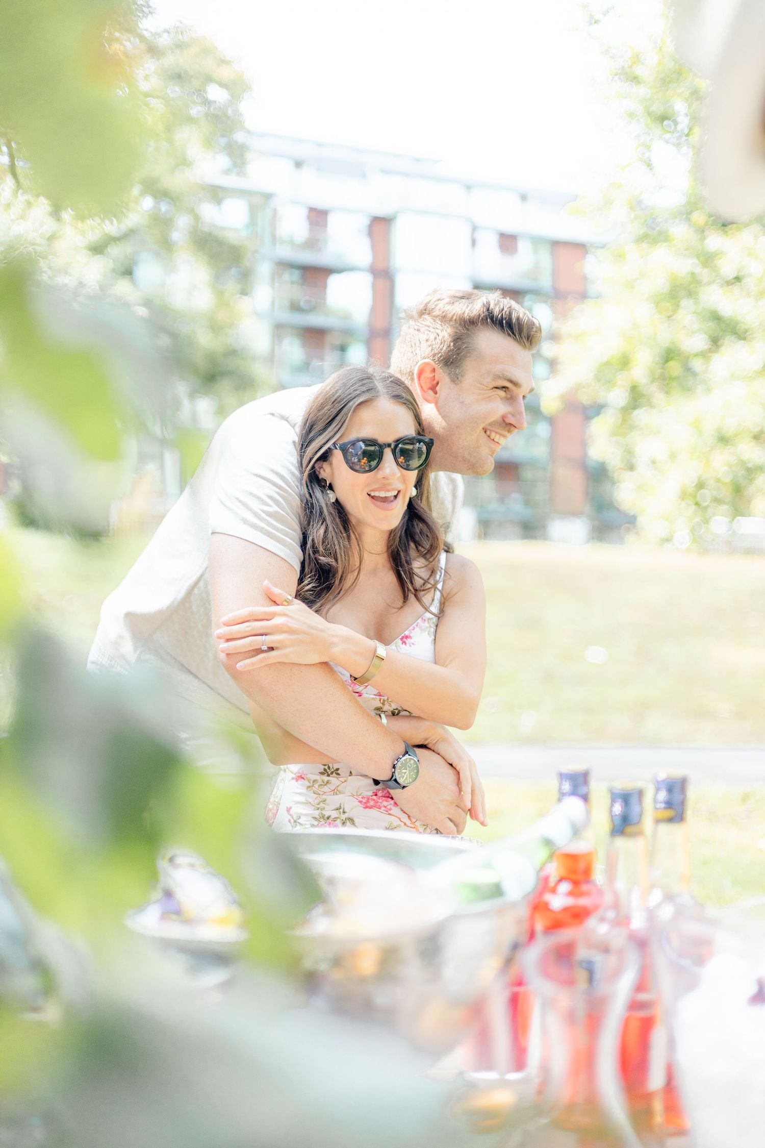 Guests sharing an intimate moment during an outdoor summer party.