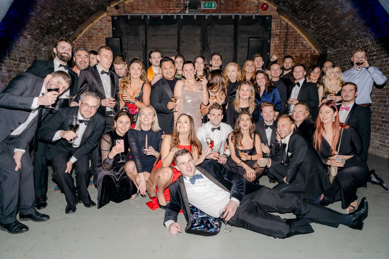Large group photo of guests celebrating at a special event.