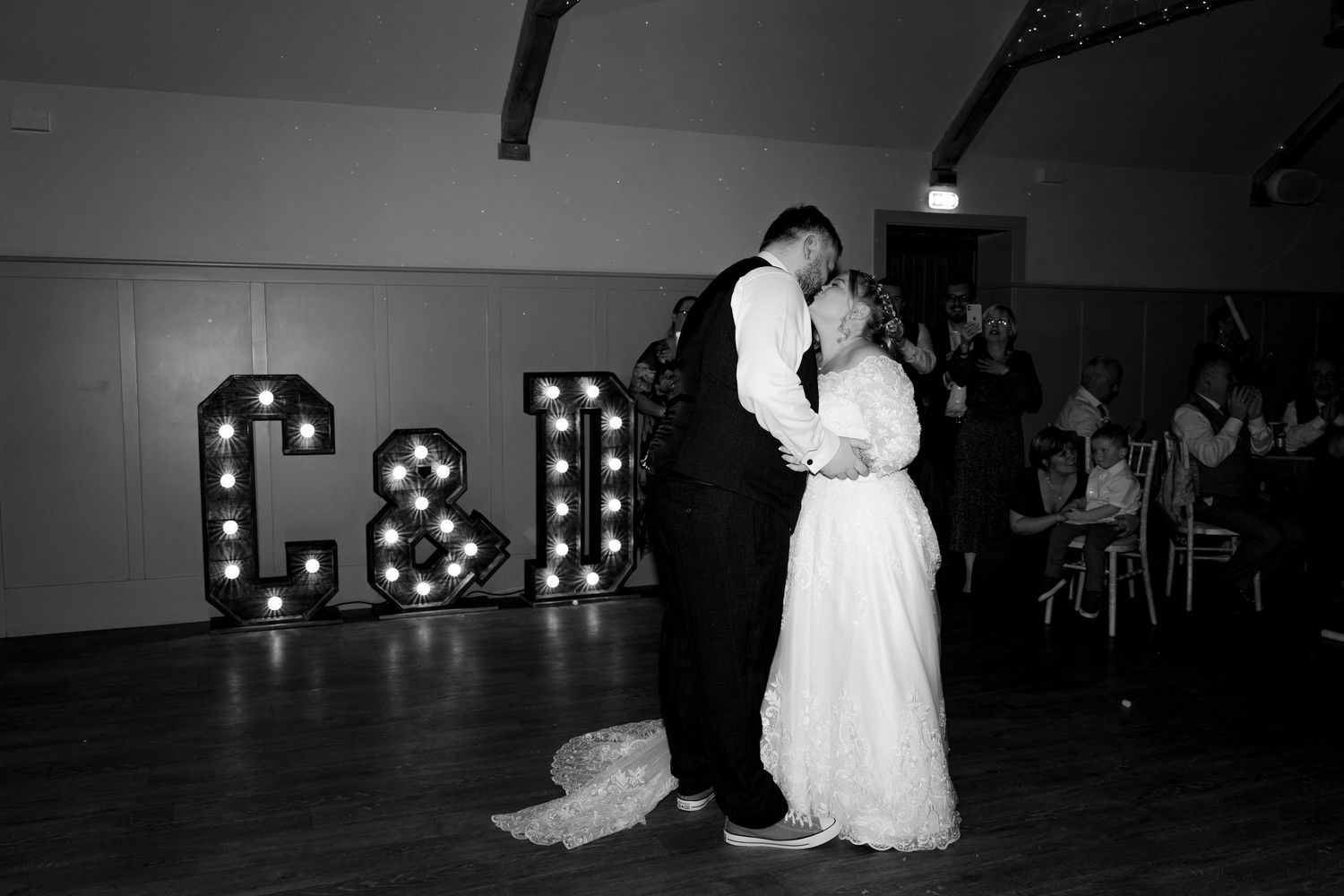Atmospheric nighttime wedding dance photos with illuminated decor.