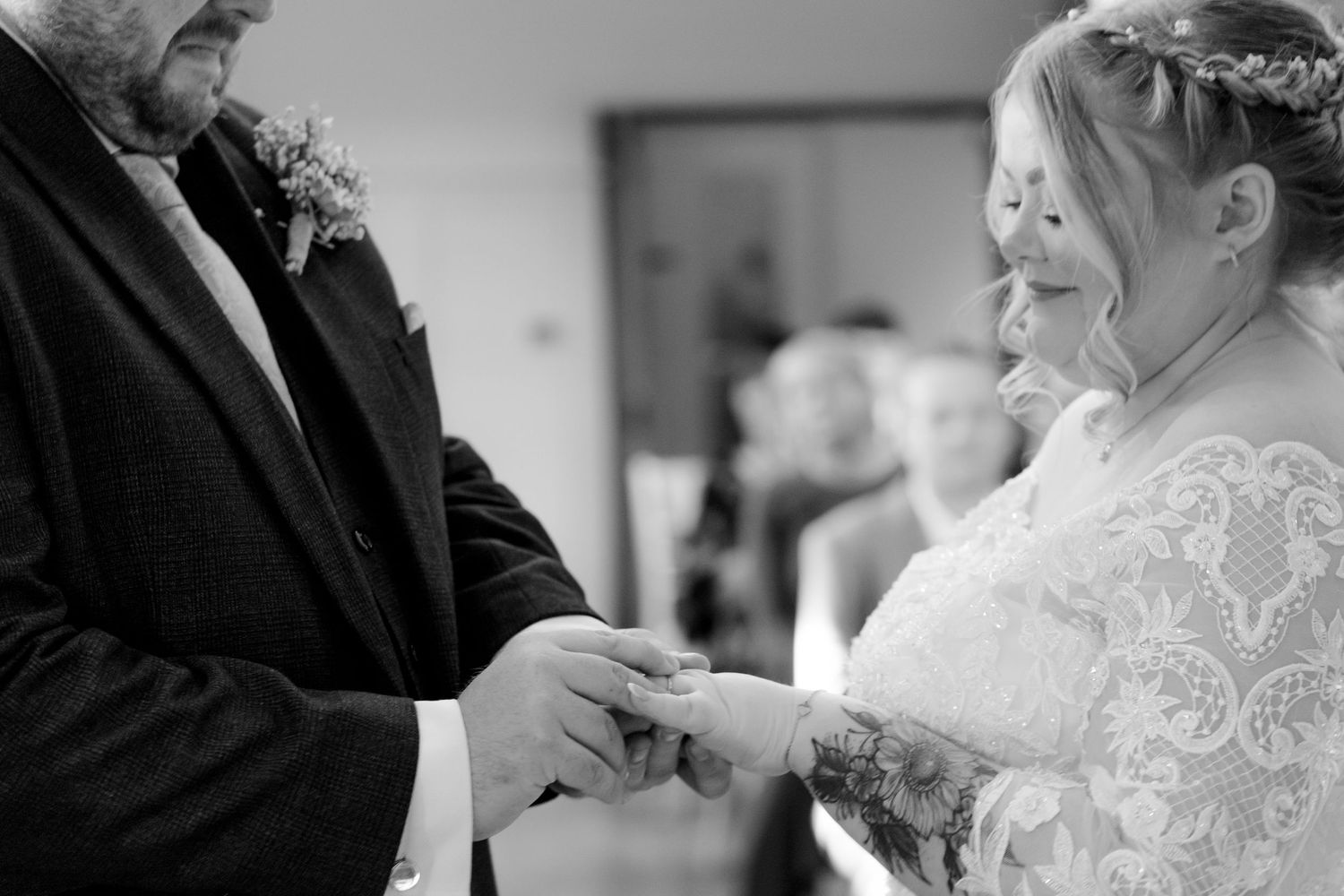 Black and white candid wedding moments showing emotional expressions.