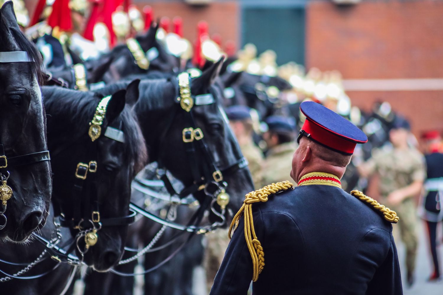 Close-up of military dress uniforms with gold braiding and ceremonial details.
