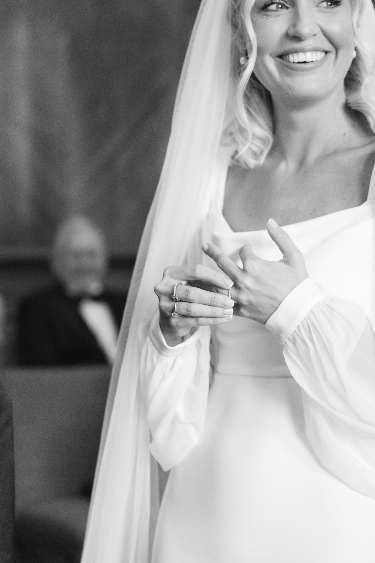 Close-up portrait shots of a bride in a white wedding dress and veil showing joyful expressions.