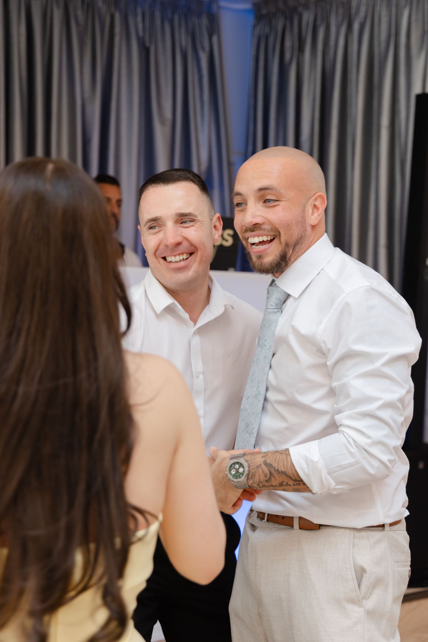 Guests sharing laughs and conversations during a social gathering.