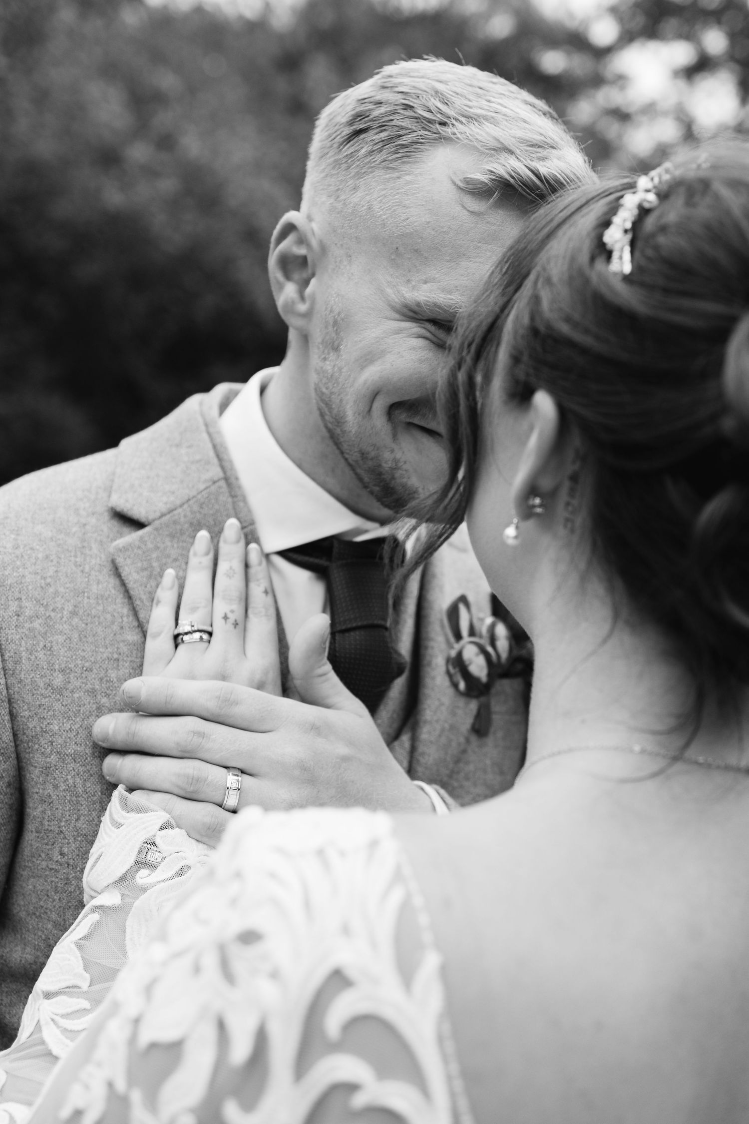 Intimate black and white wedding portraits showing tender romantic moments.