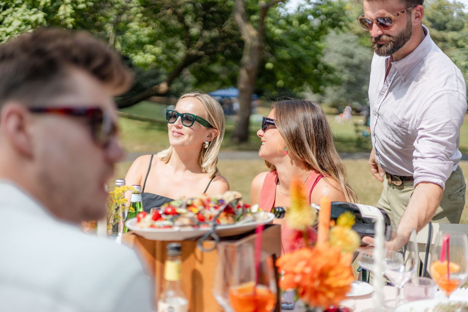 Guests enjoying a casual outdoor dining experience with colorful refreshments.