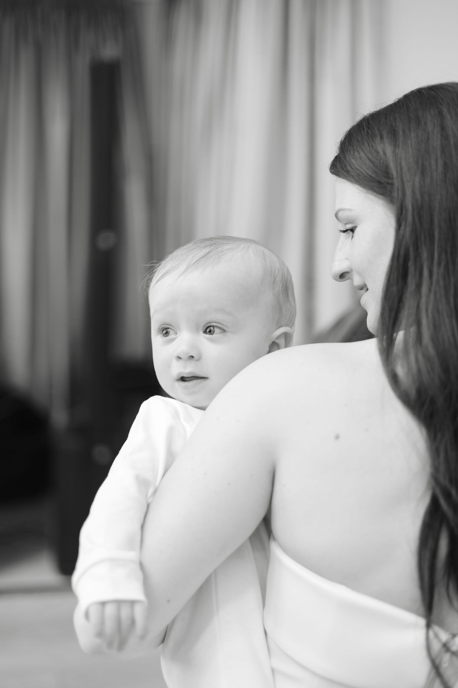 Black and white close-up shots of tender moments during a dance.